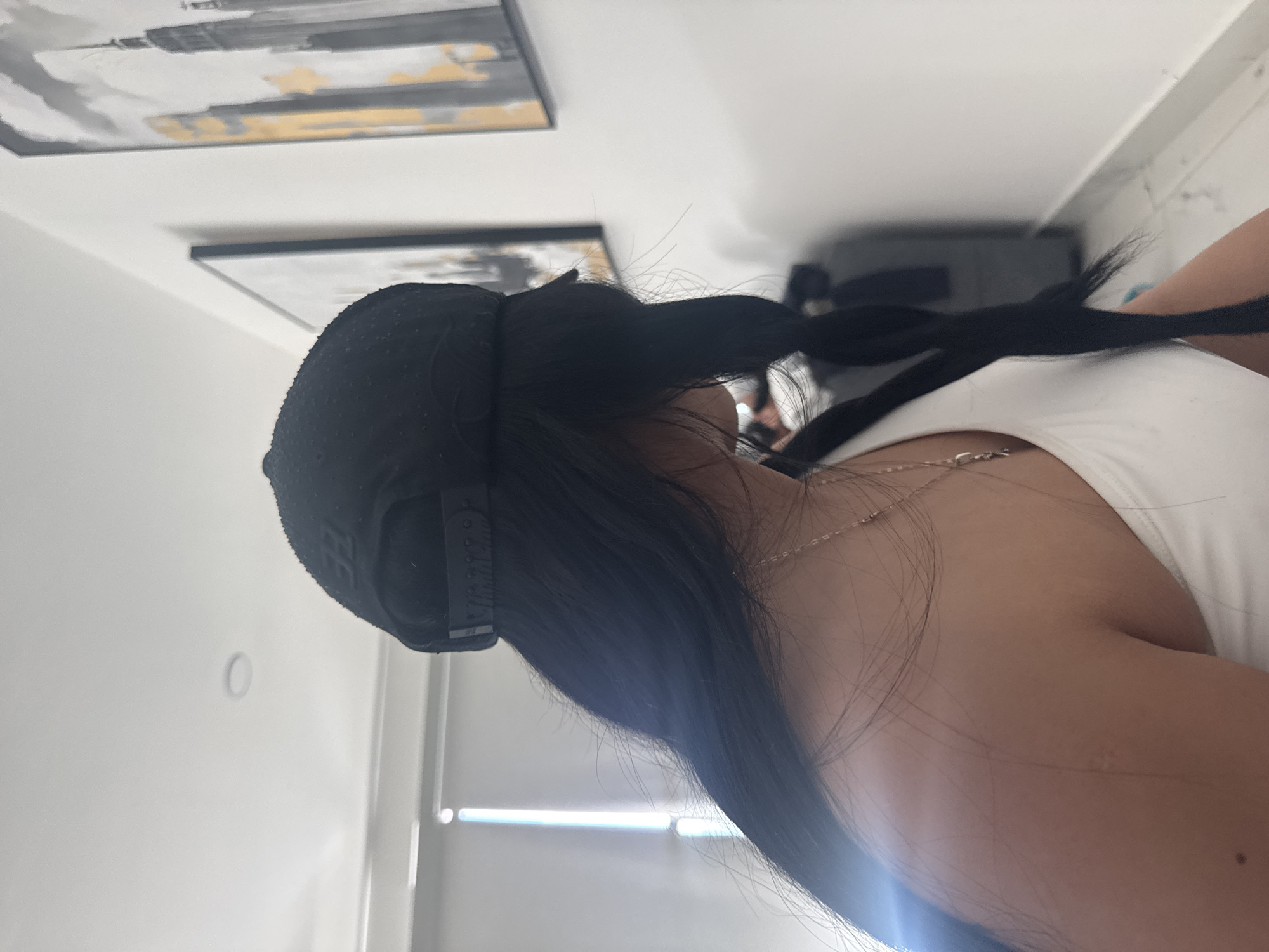 Person in casual attire observed near wall art in Mexico