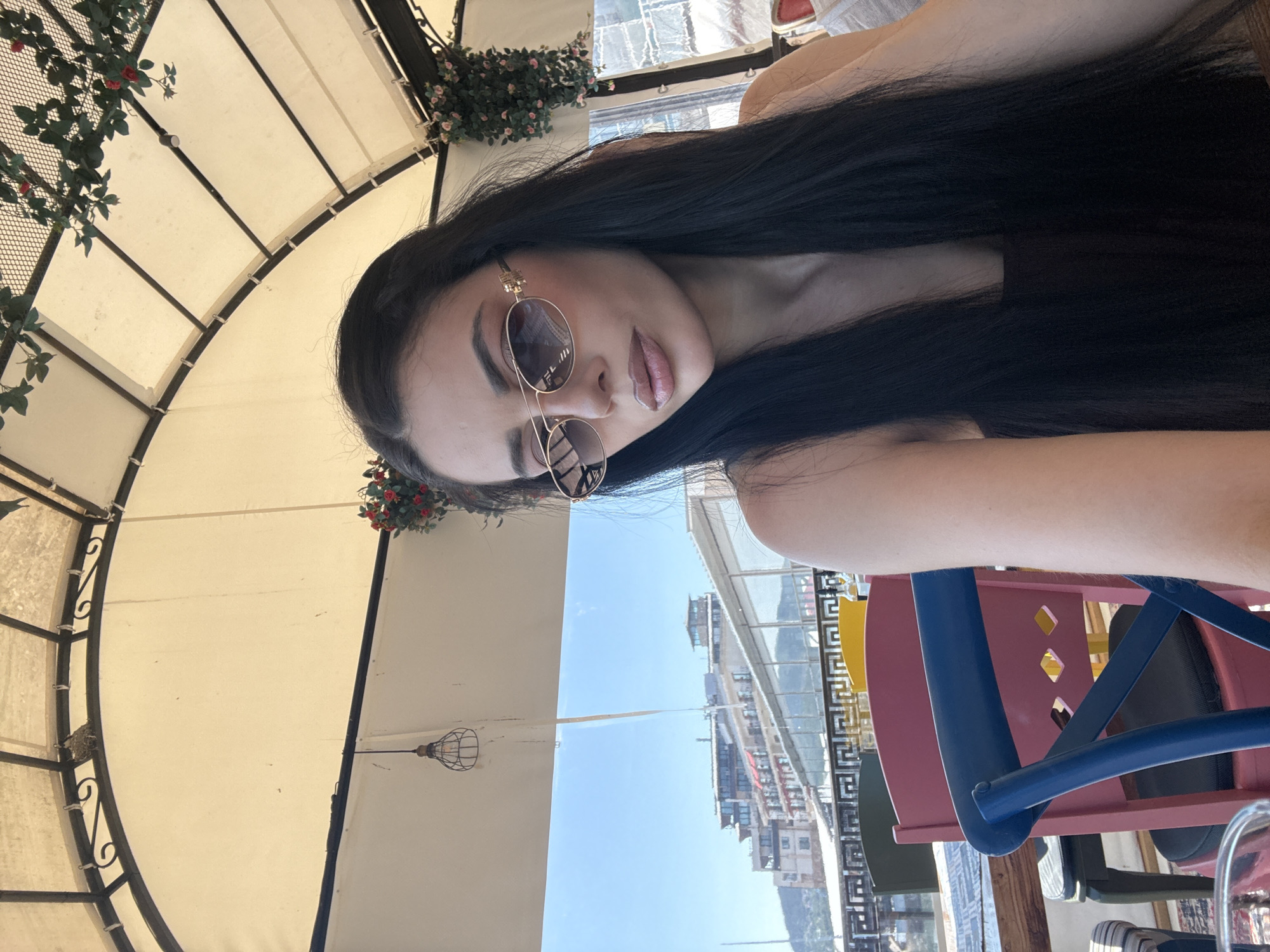 Tourist captures waterfront cafe and marina scenes during midday visit