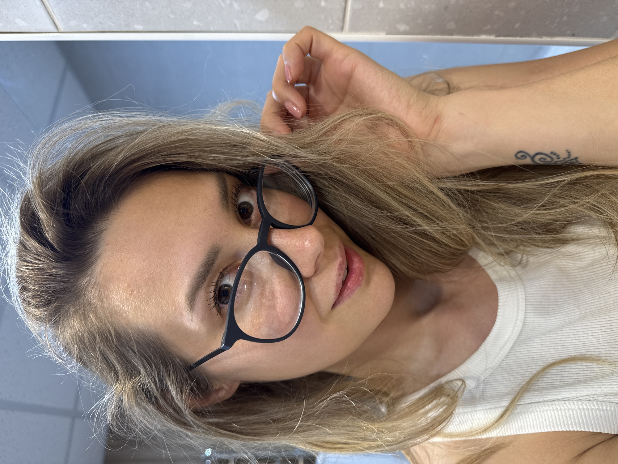 Woman takes bathroom selfies in Nebug, Russia