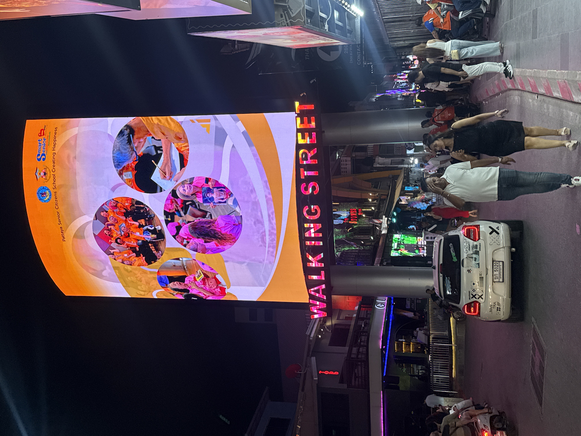 Evening crowds gather on Pattaya's illuminated Walking Street