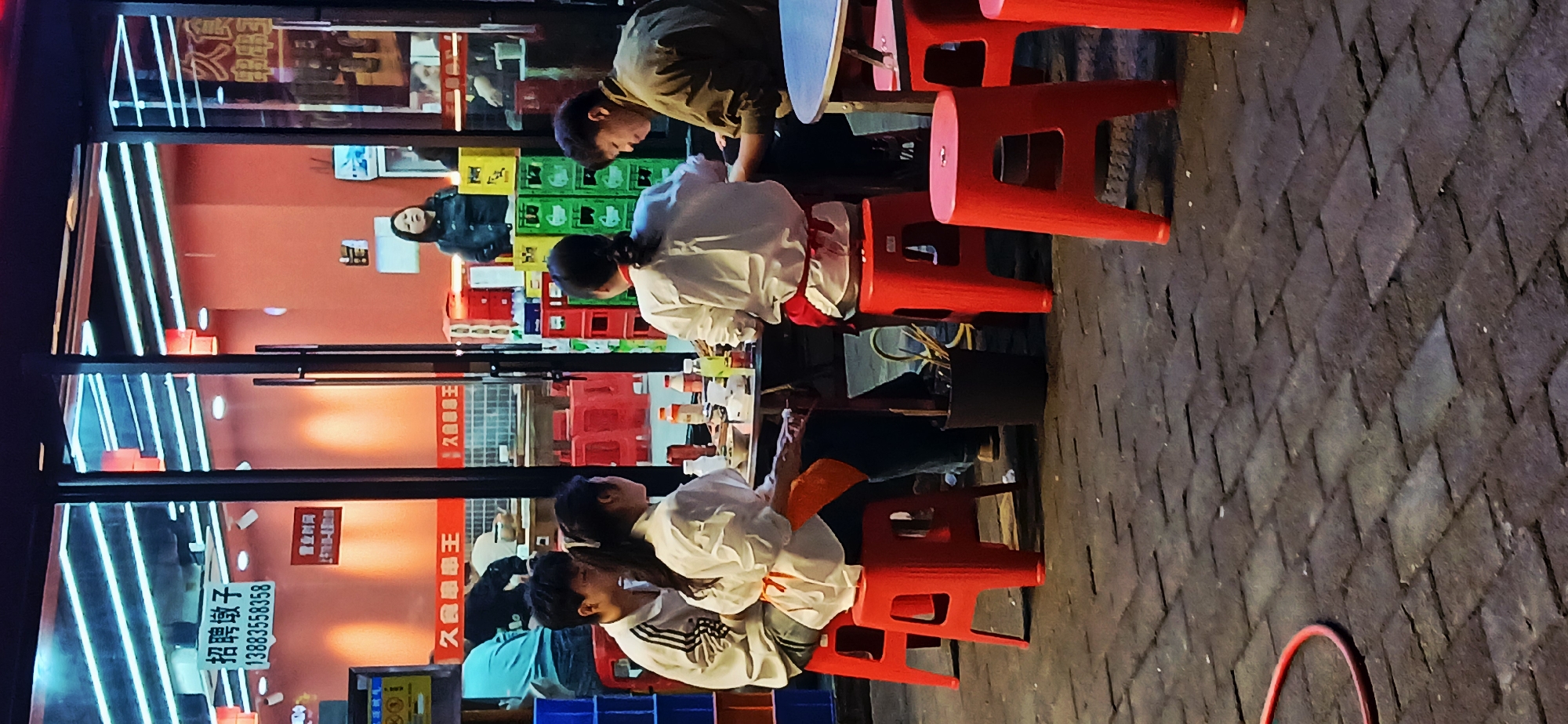 Evening street life unfolds in Jiulongpo District, China