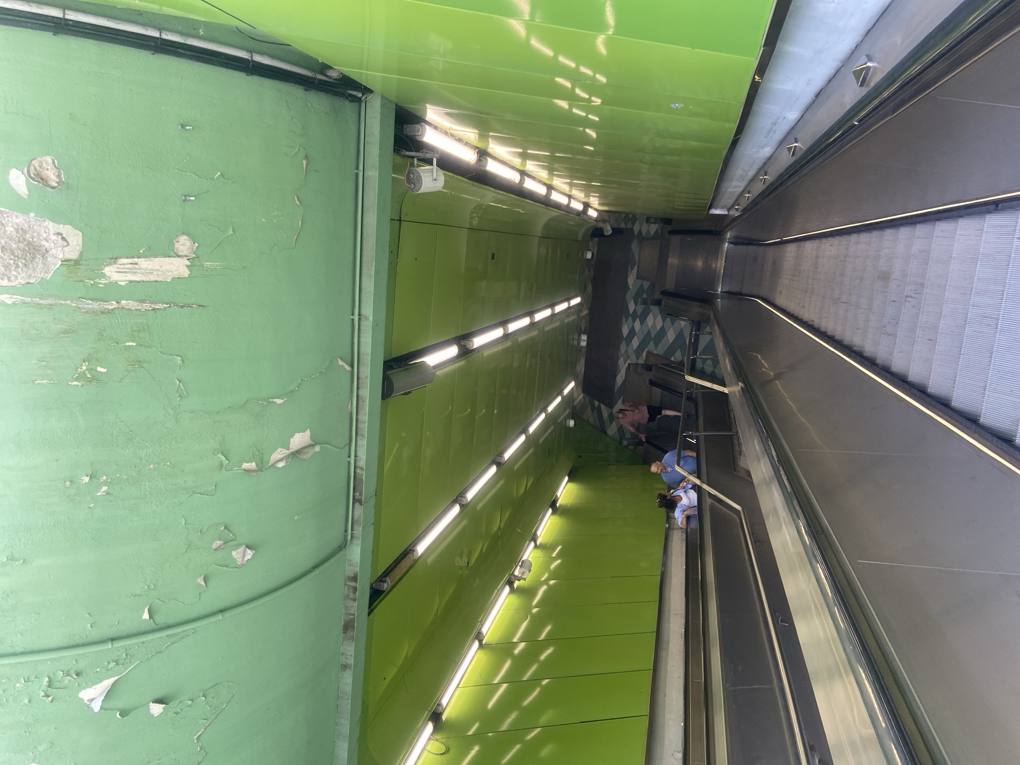 Park paths, a waterfall, and a subway escalator on one afternoon