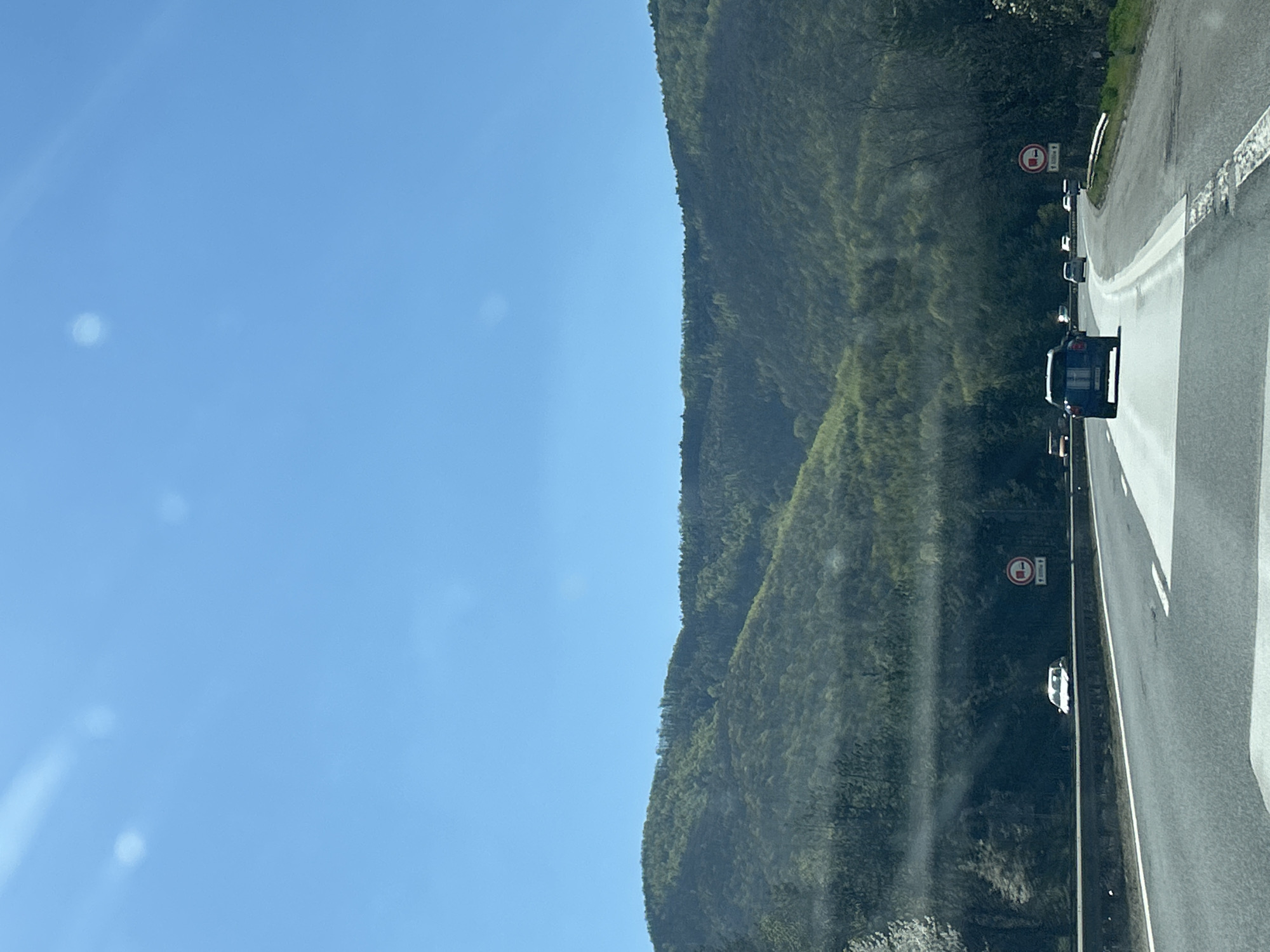 Vehicles navigate mountain road near Dolno Varshilo, Bulgaria