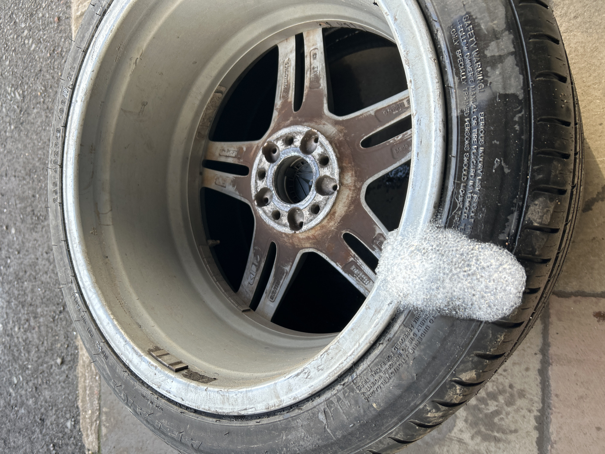 Abandoned rusted wheel found on concrete in Rutherglen