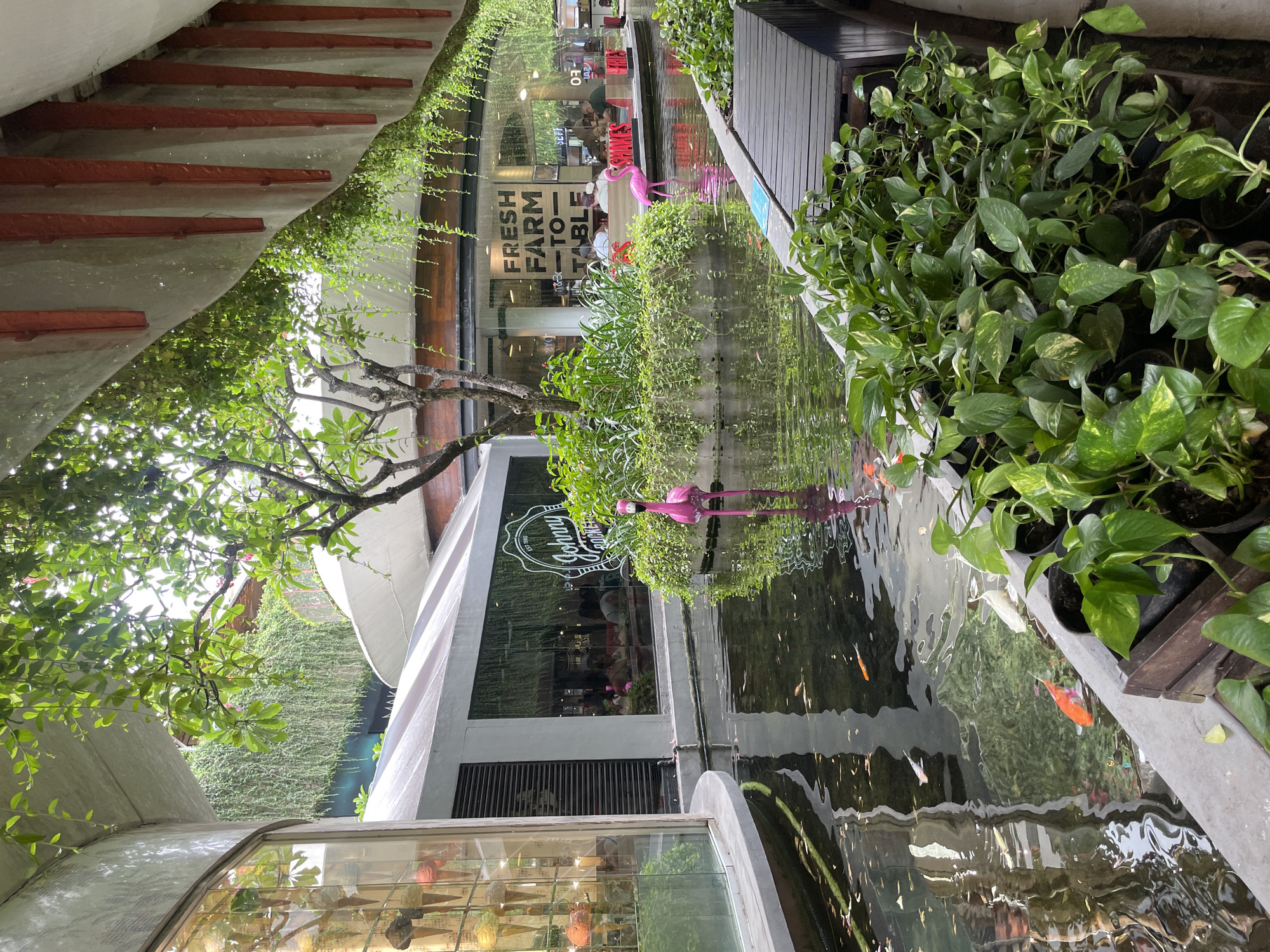 Early morning shoppers browse outdoor retail complex in Kuta