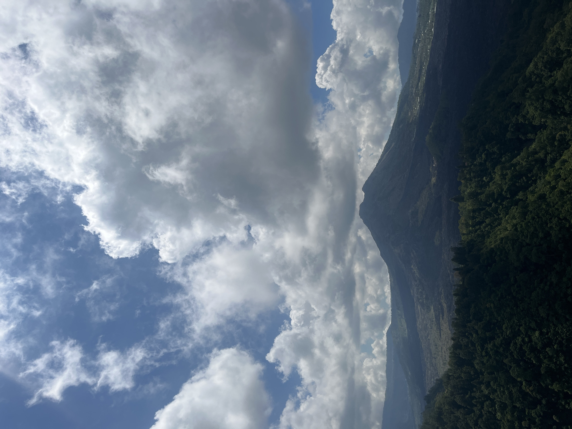 Tourist captures scenic mountain lake views in Kintamani, Indonesia