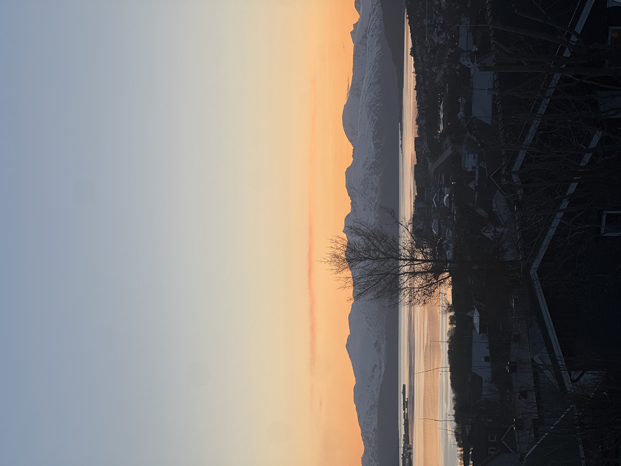 Arctic sunset documented over Tromsø cityscape and infrastructure