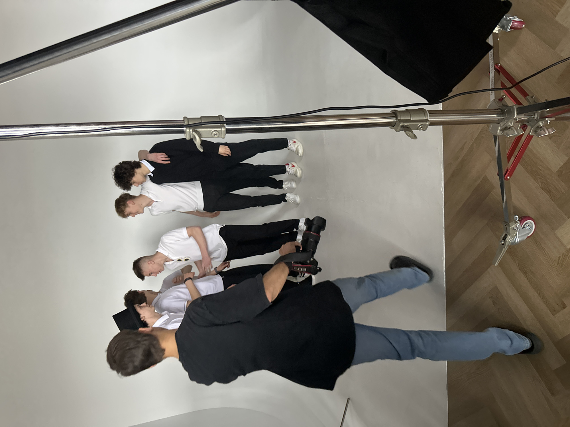 Studio photo shoot captures four men in coordinated outfits