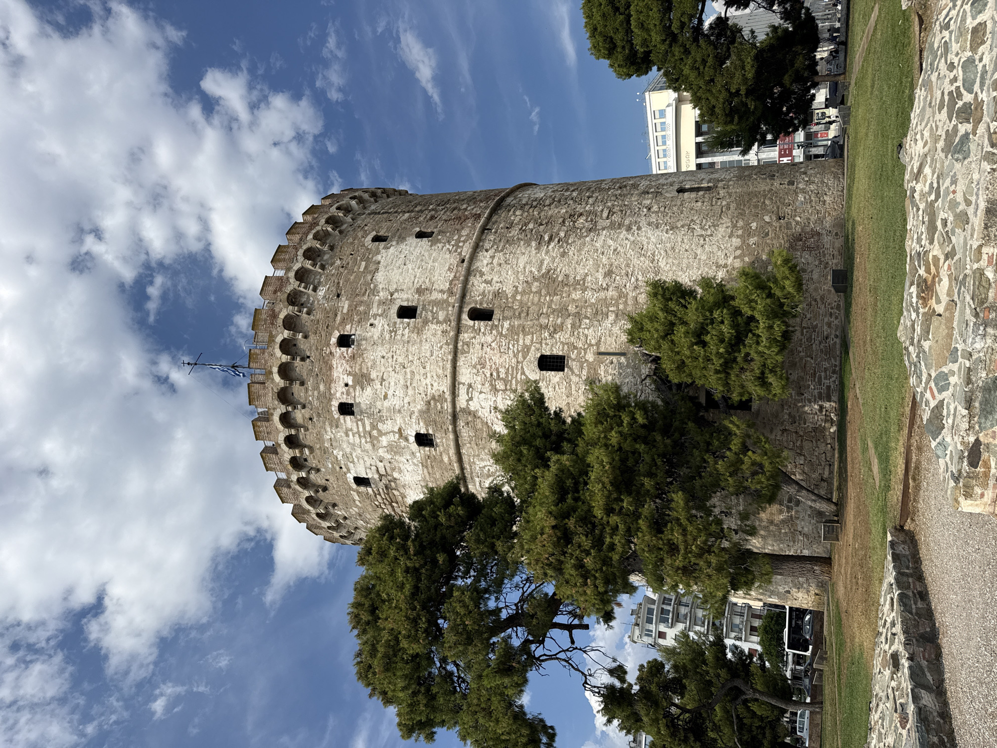 Thessaloniki waterfront: landmarks, scooters, and street entertainment