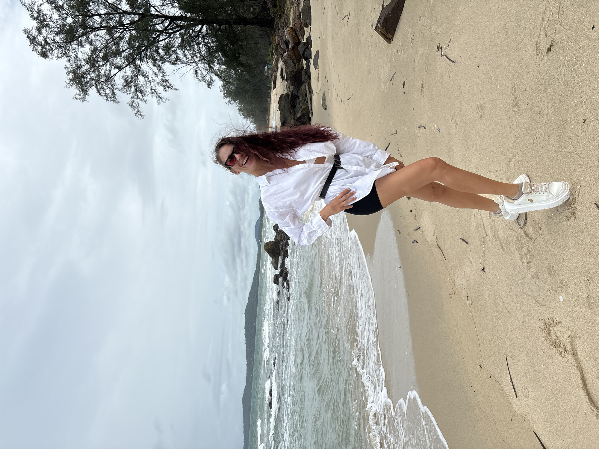 Beach day selfies and surroundings under a cloudy sky