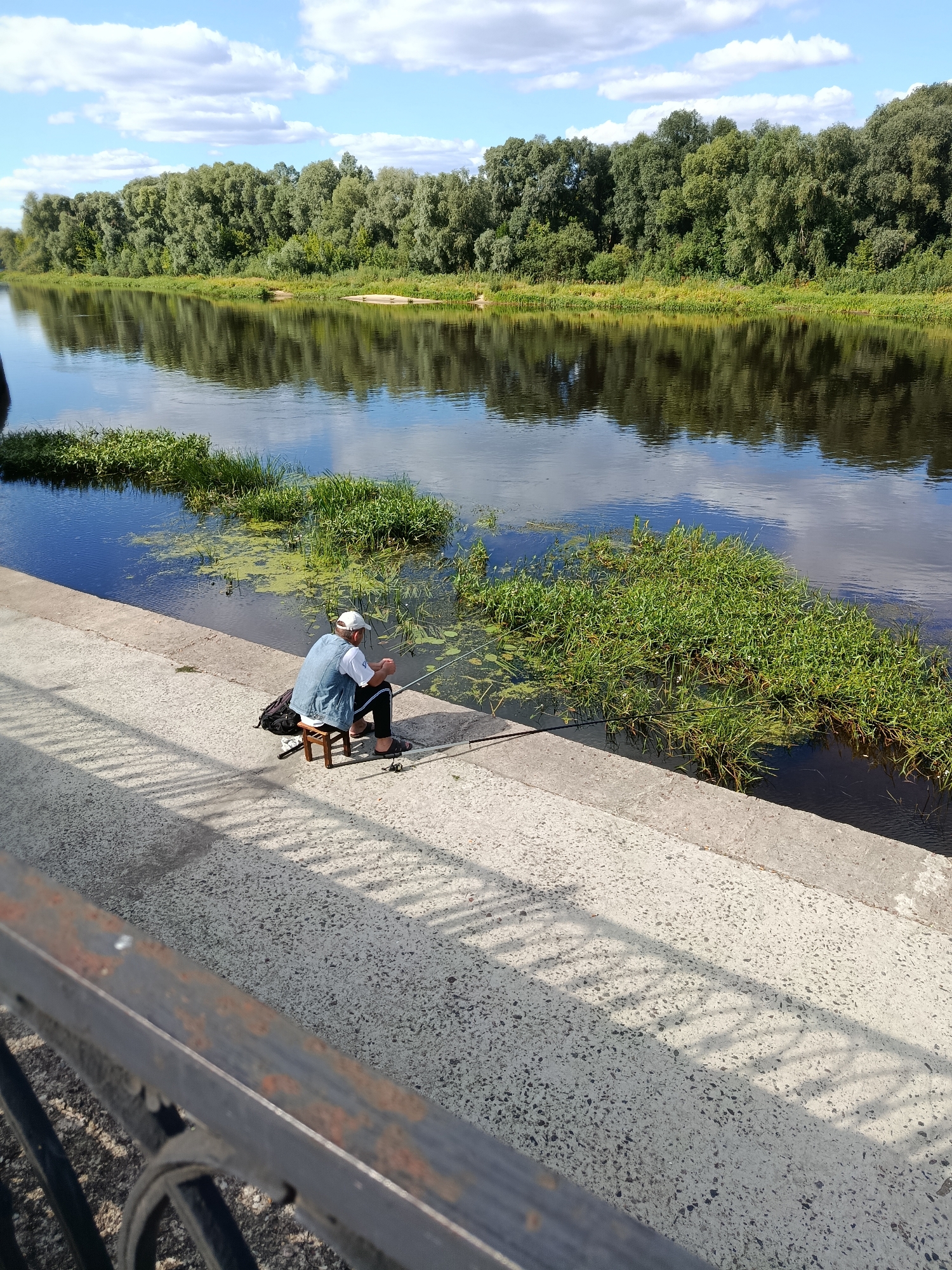Lazy afternoon fishing and riverside strolling in Svietlahorsk, Belarus