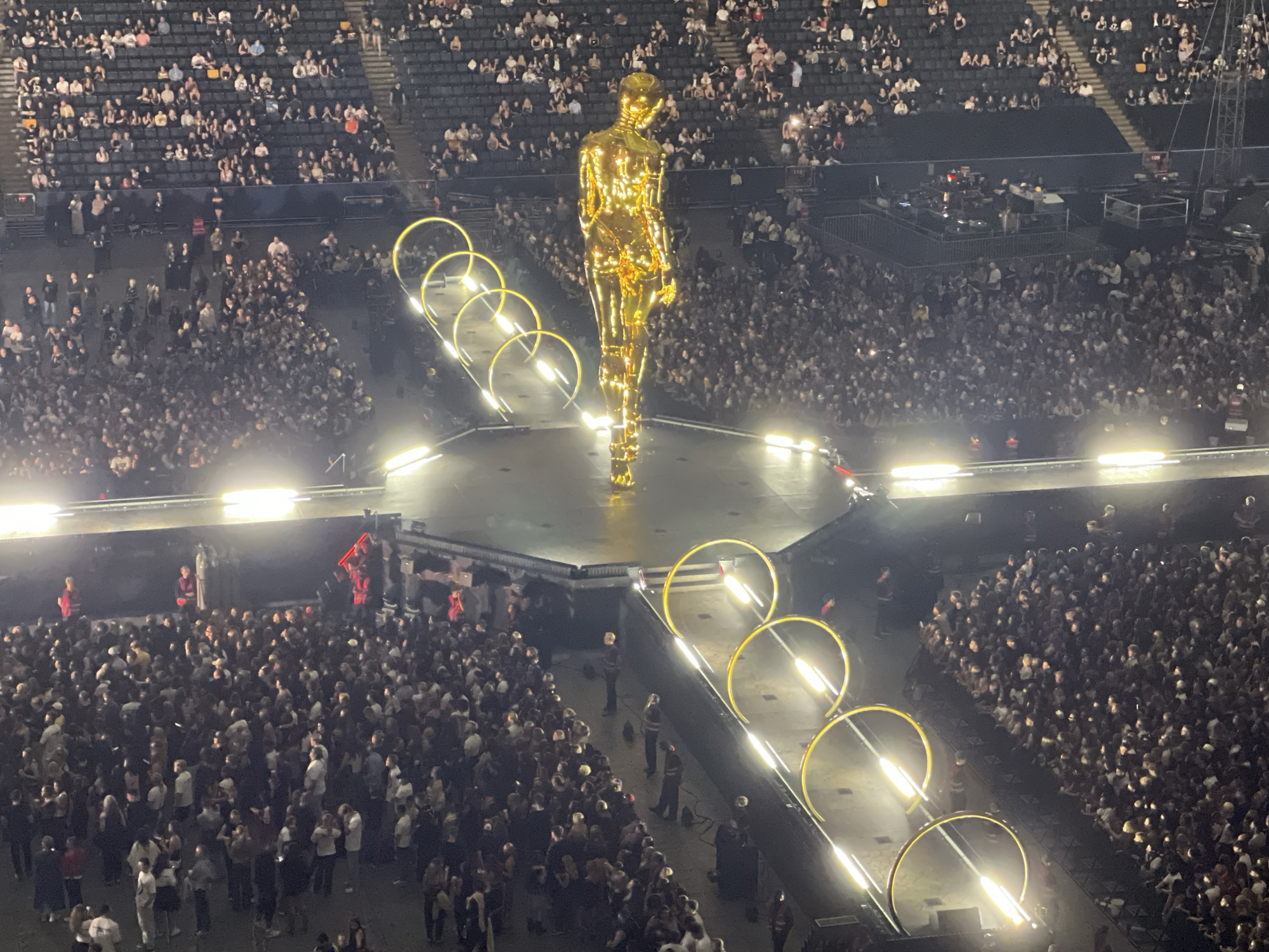Massive concert at Friends Arena with towering golden stage statue