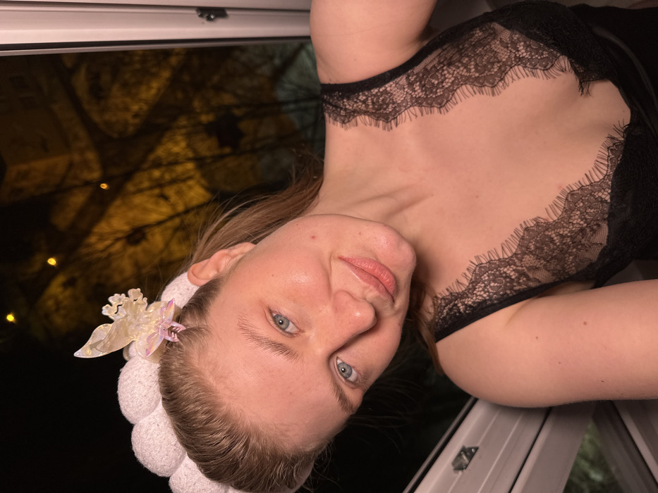 Woman documents evening selfie session in Kazan apartment