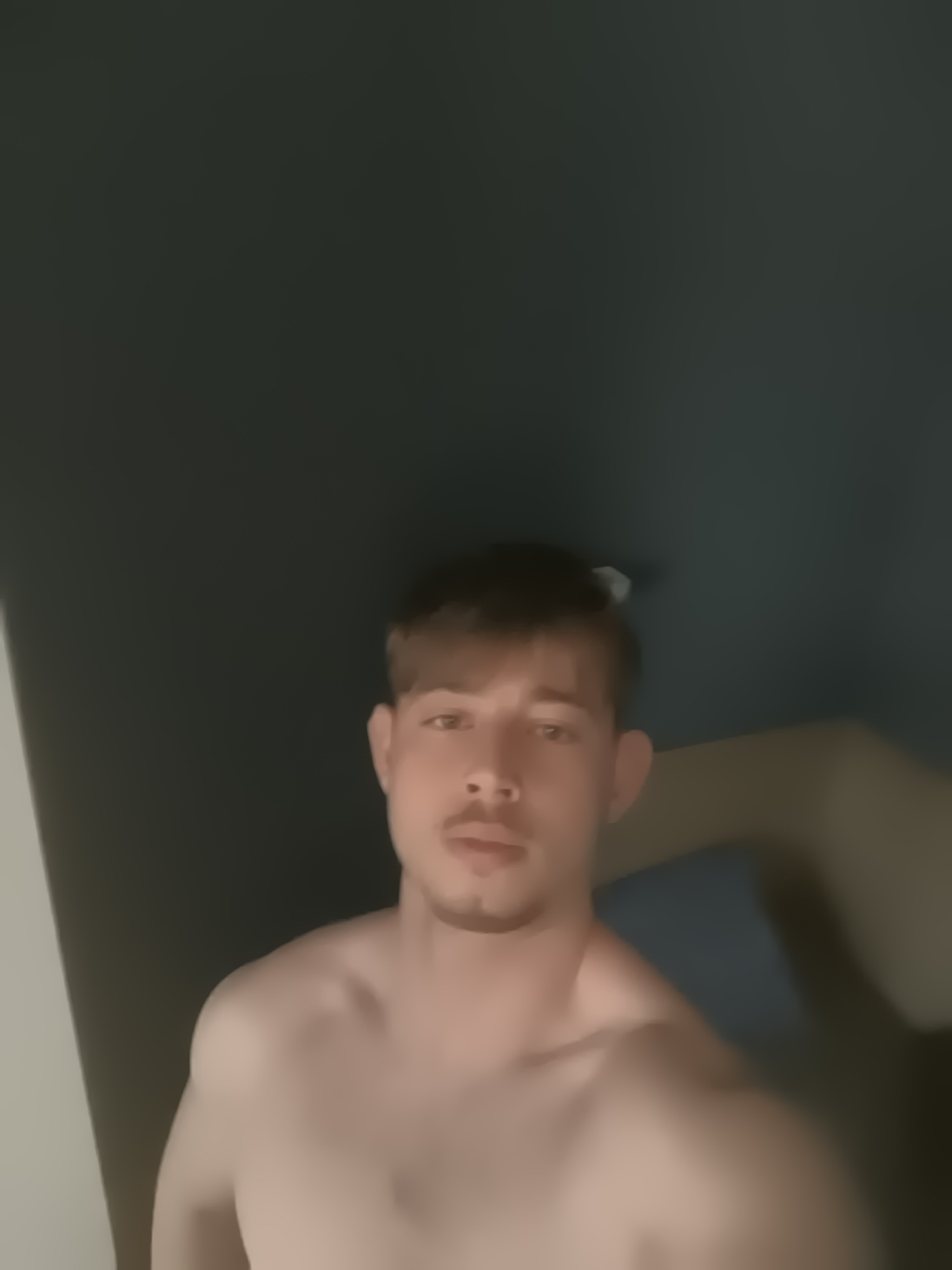 Man takes multiple selfies indoors in Sofia