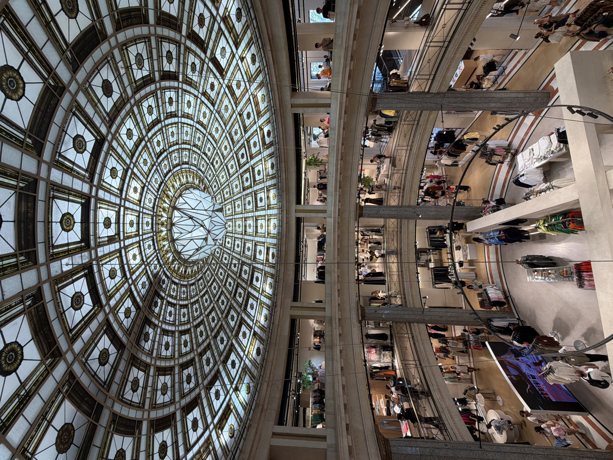 Inside a Barcelona department store with a stunning stained-glass dome