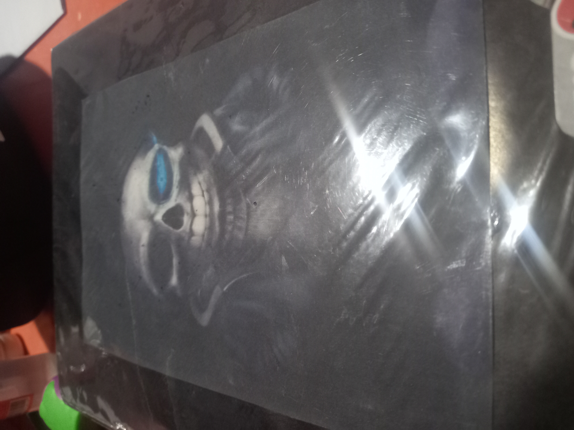 Mysterious skull artwork with glowing blue eye spotted in Trujillo
