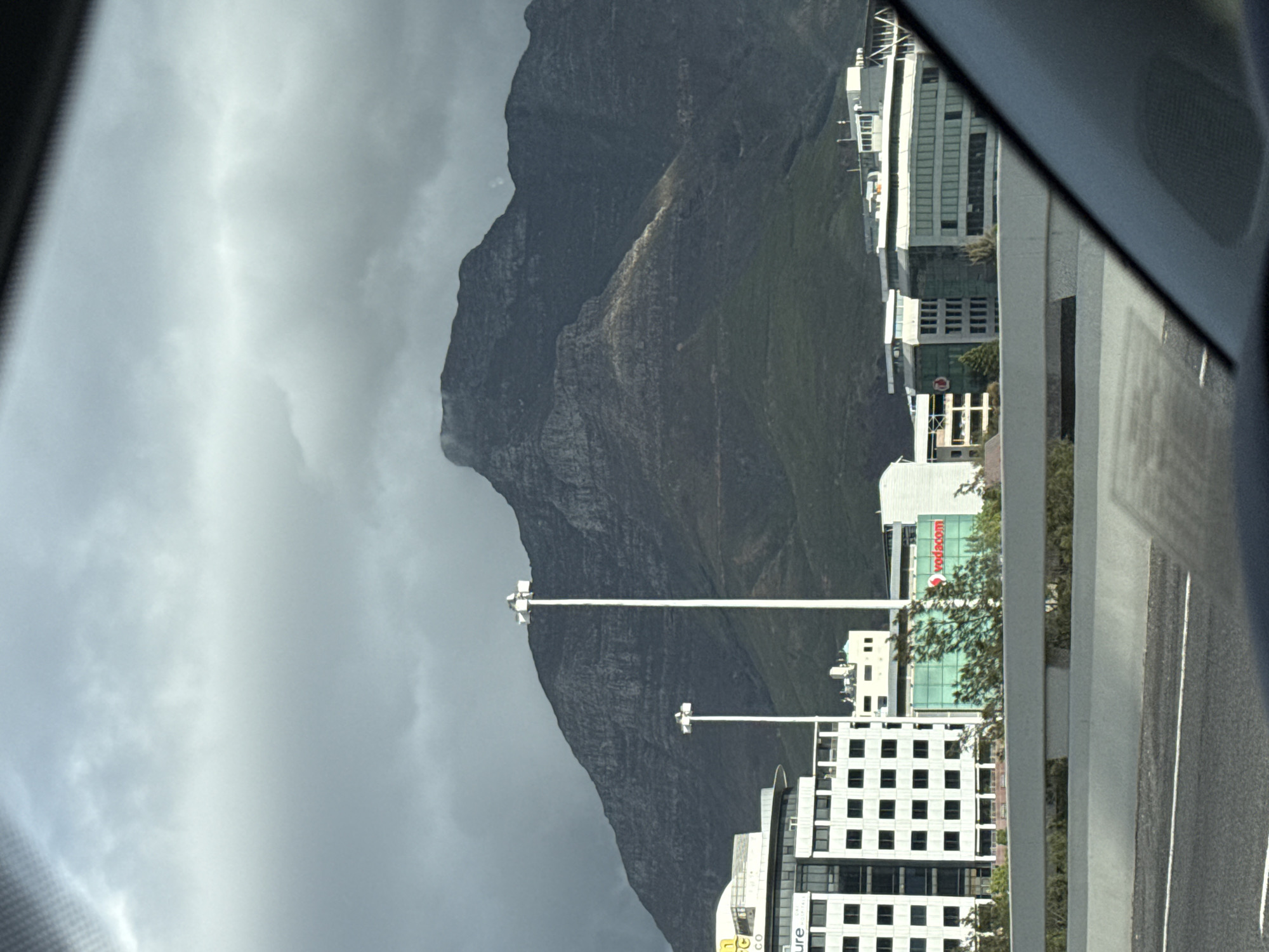 Cloudy Table Mountain photographed from vehicle in Cape Town