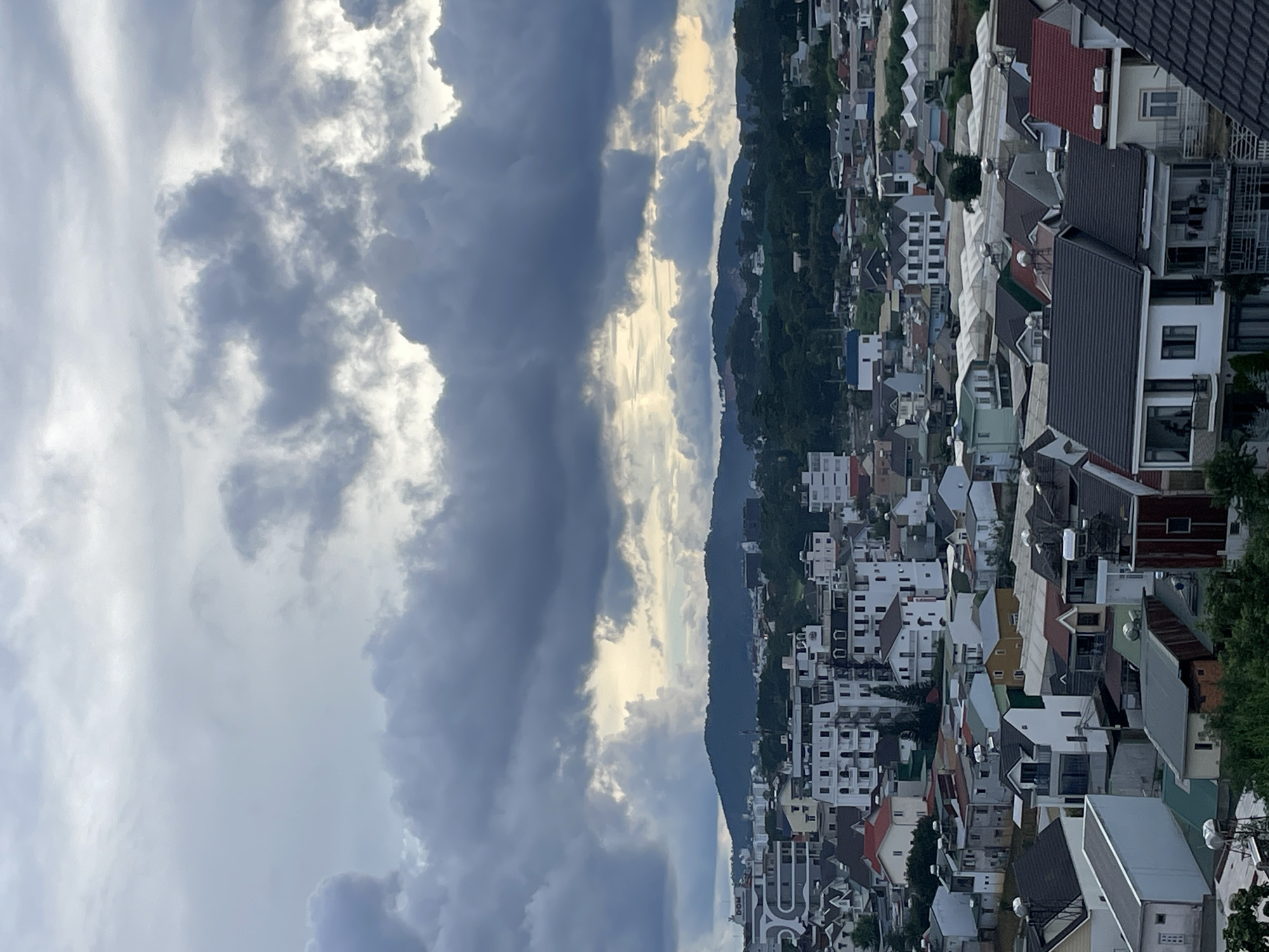 Đà Lạt rooftops under a stormy sky