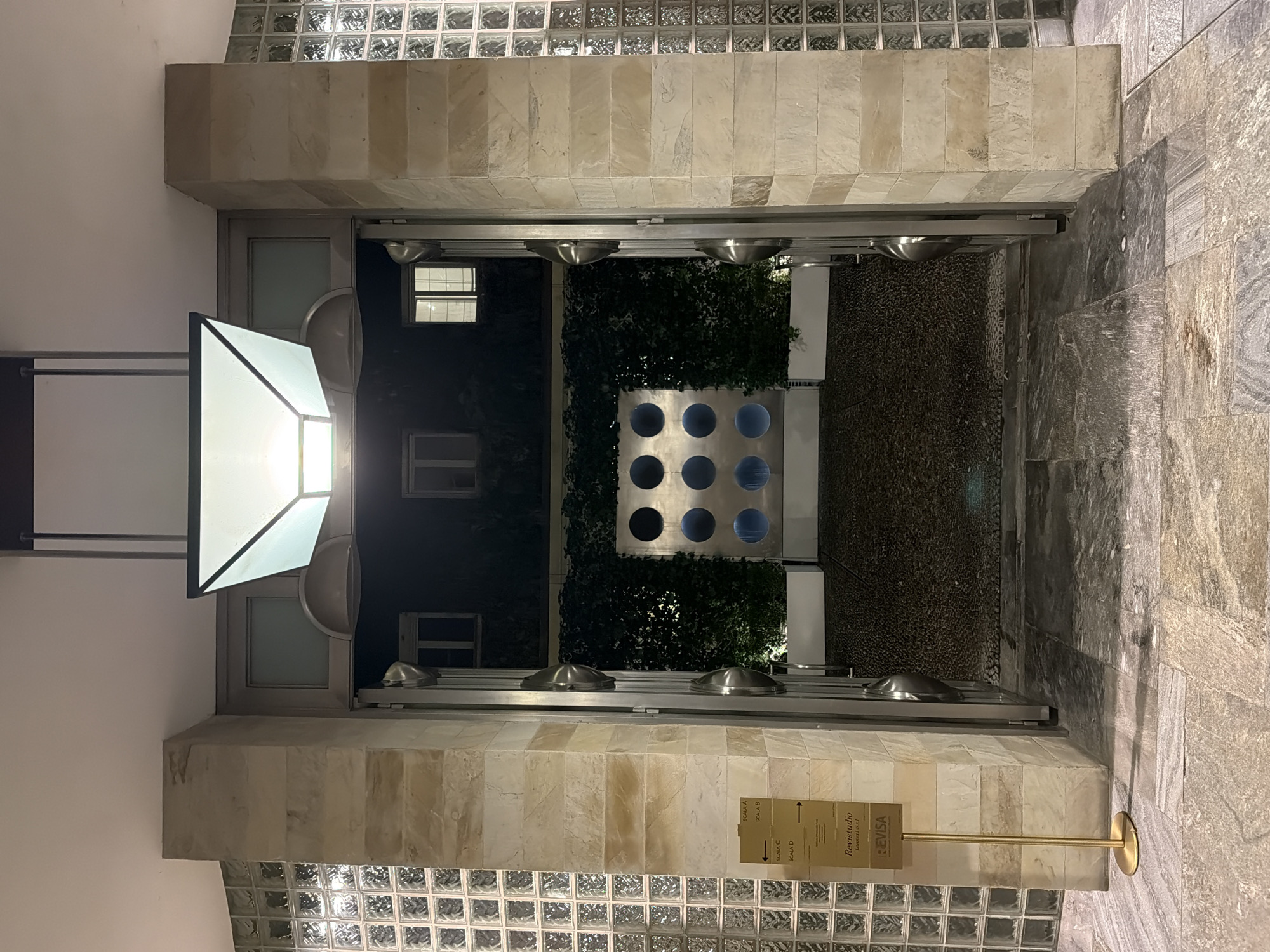 Evening courtyard scene captured in Milan, Italy