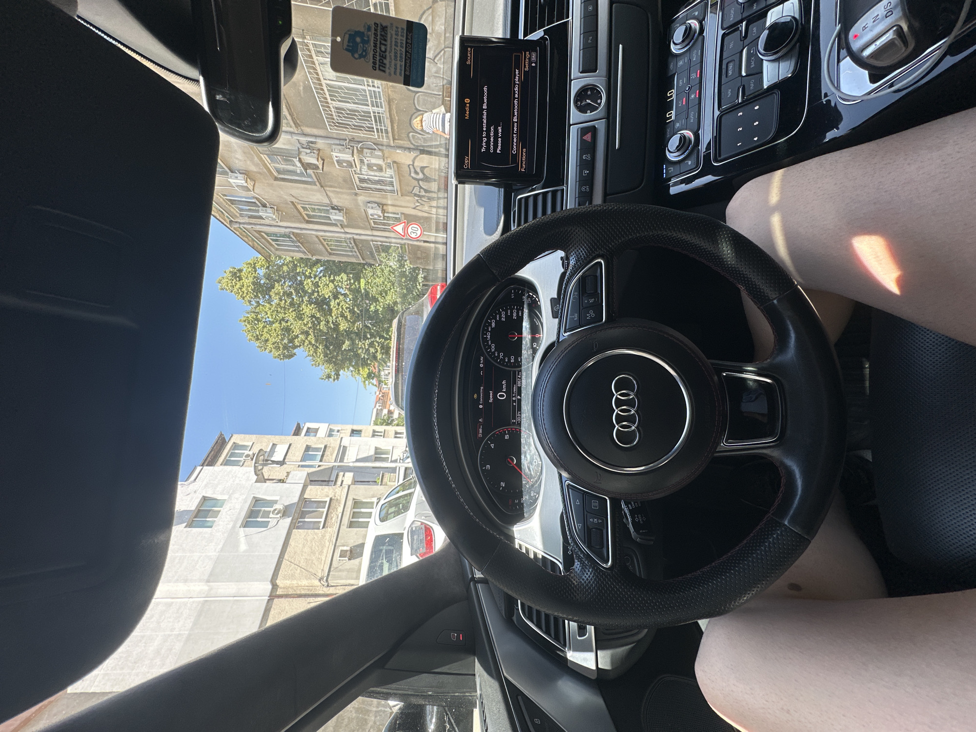 Black Audi parked on a Ruse street, inside and out