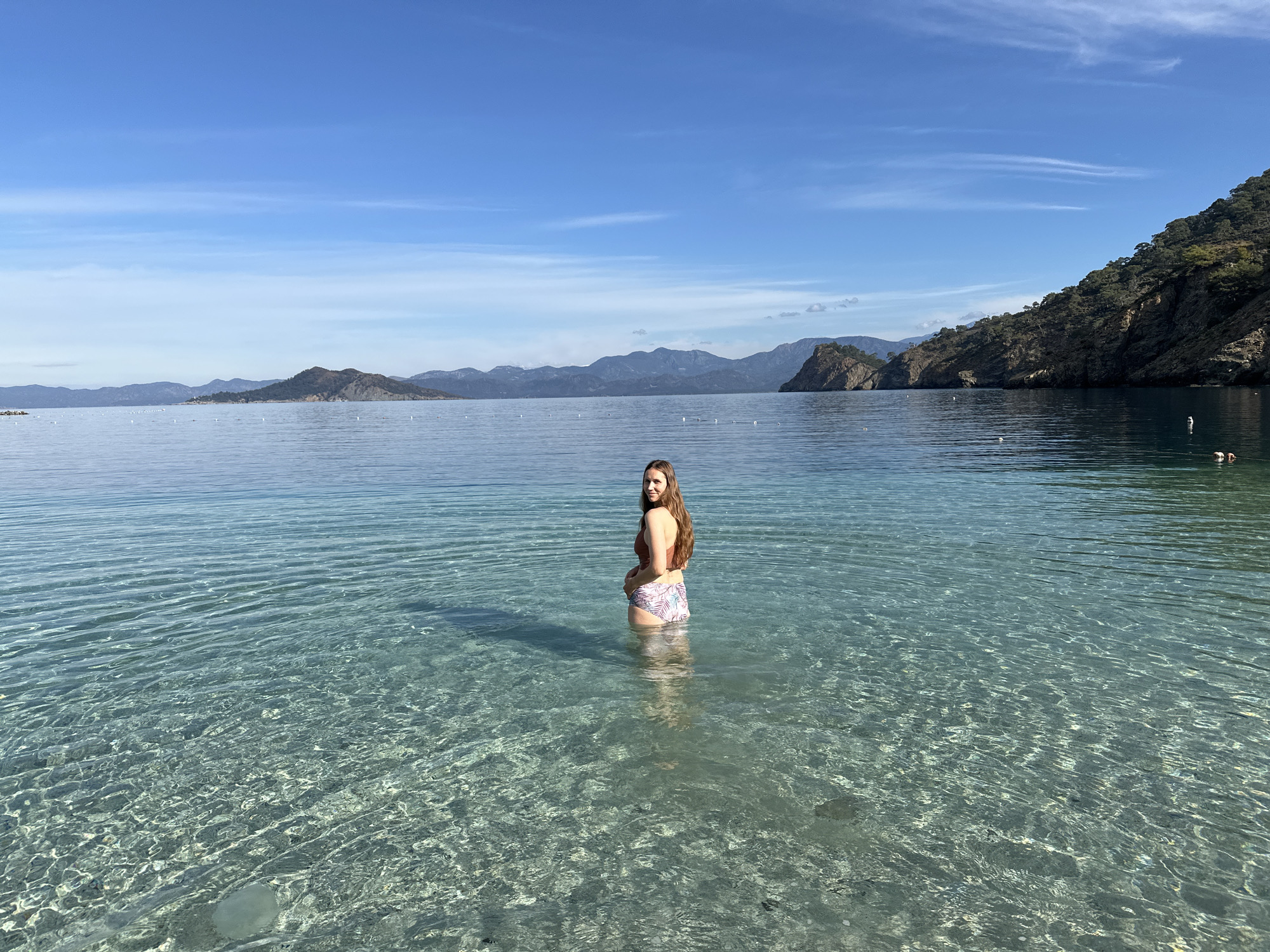 Man sets up beachside table service in Fethiye Turkey