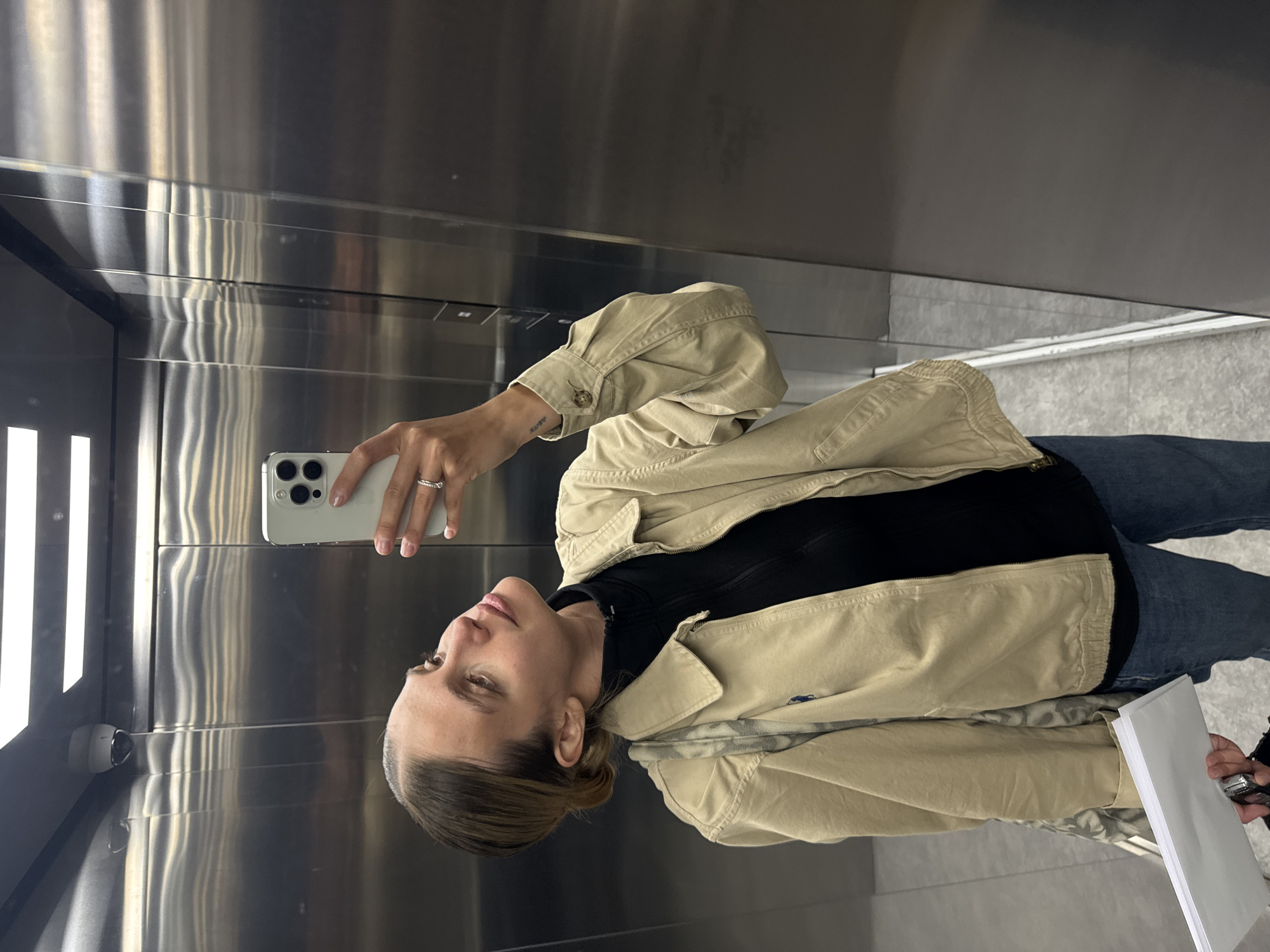 Woman Takes Selfie in Elevator