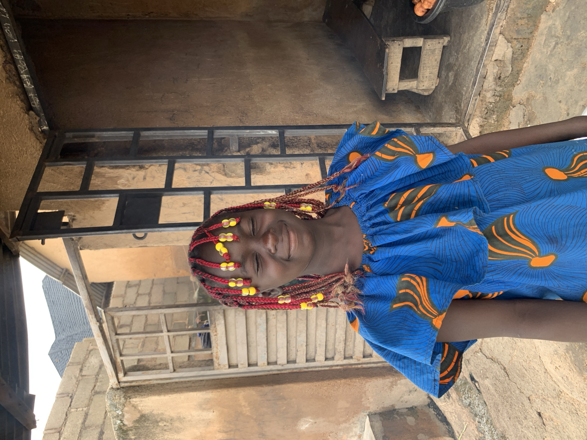Colorful beads and patterned clothing in urban Jos