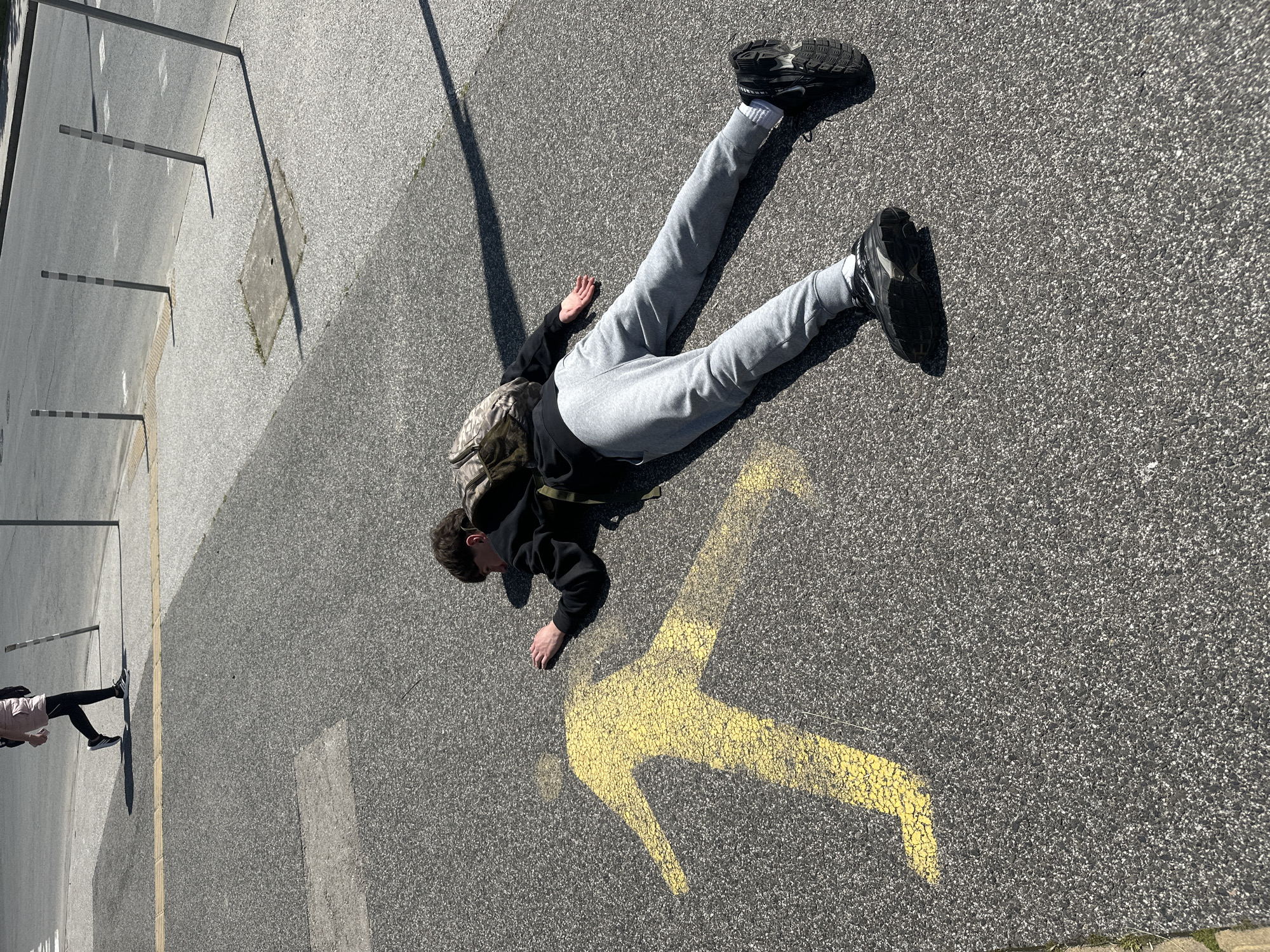 Person lying on street near Plovdiv stadium crossing
