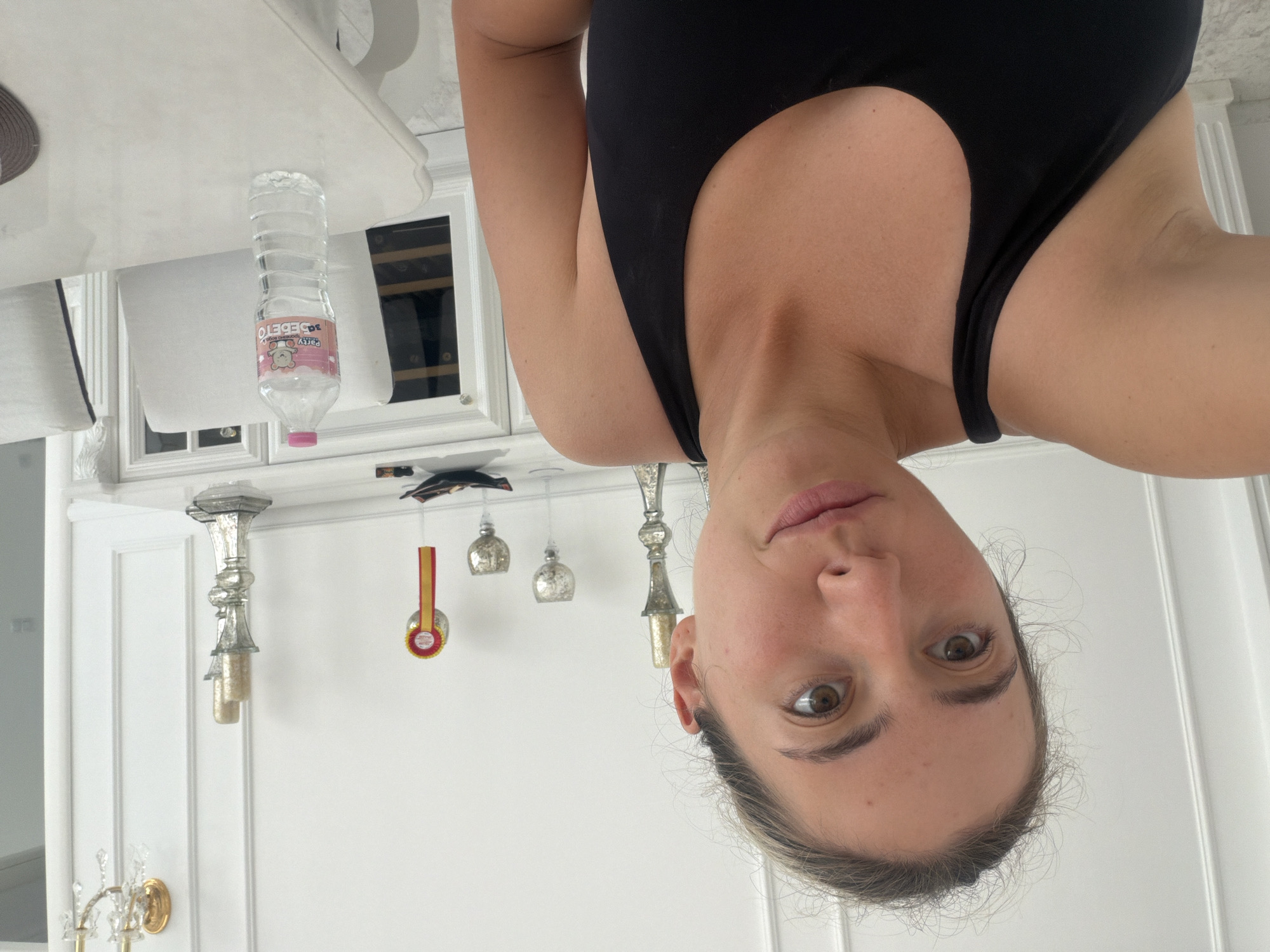 Woman takes selfies at indoor locations in Tankovo, Bulgaria