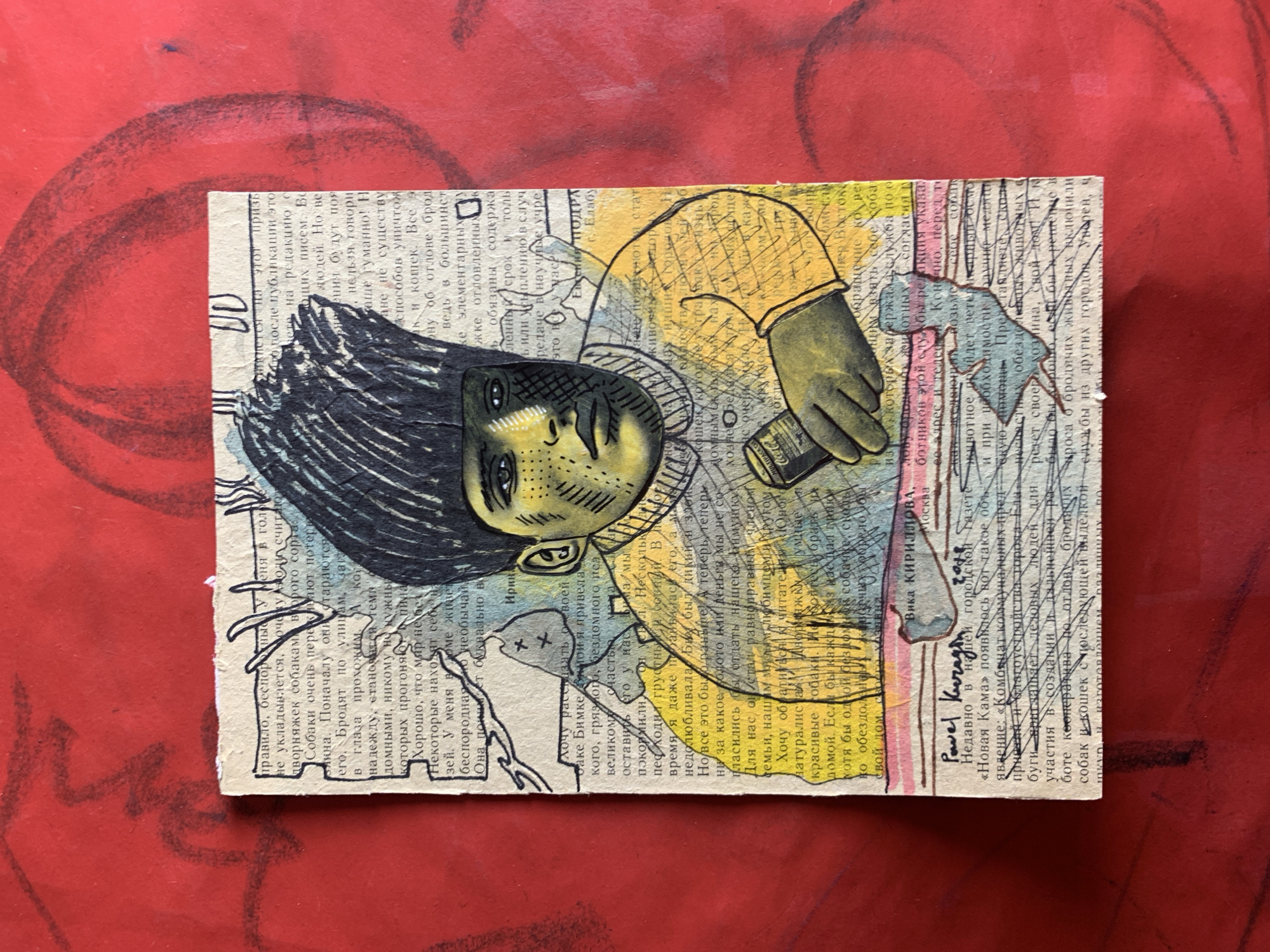 Collage portraits and quantum-themed prompt cards spread across red surfaces