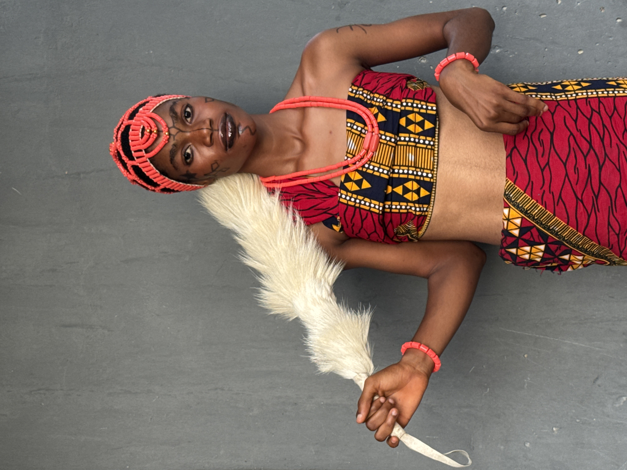 Woman in traditional Igbo attire photographed during cultural ceremony