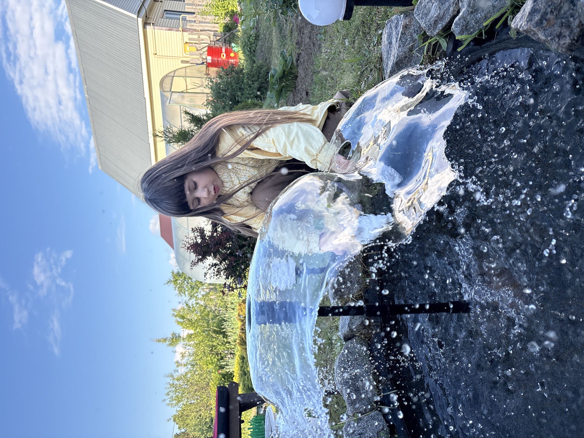 Young person enjoys garden day in Chaikovsky, Russia