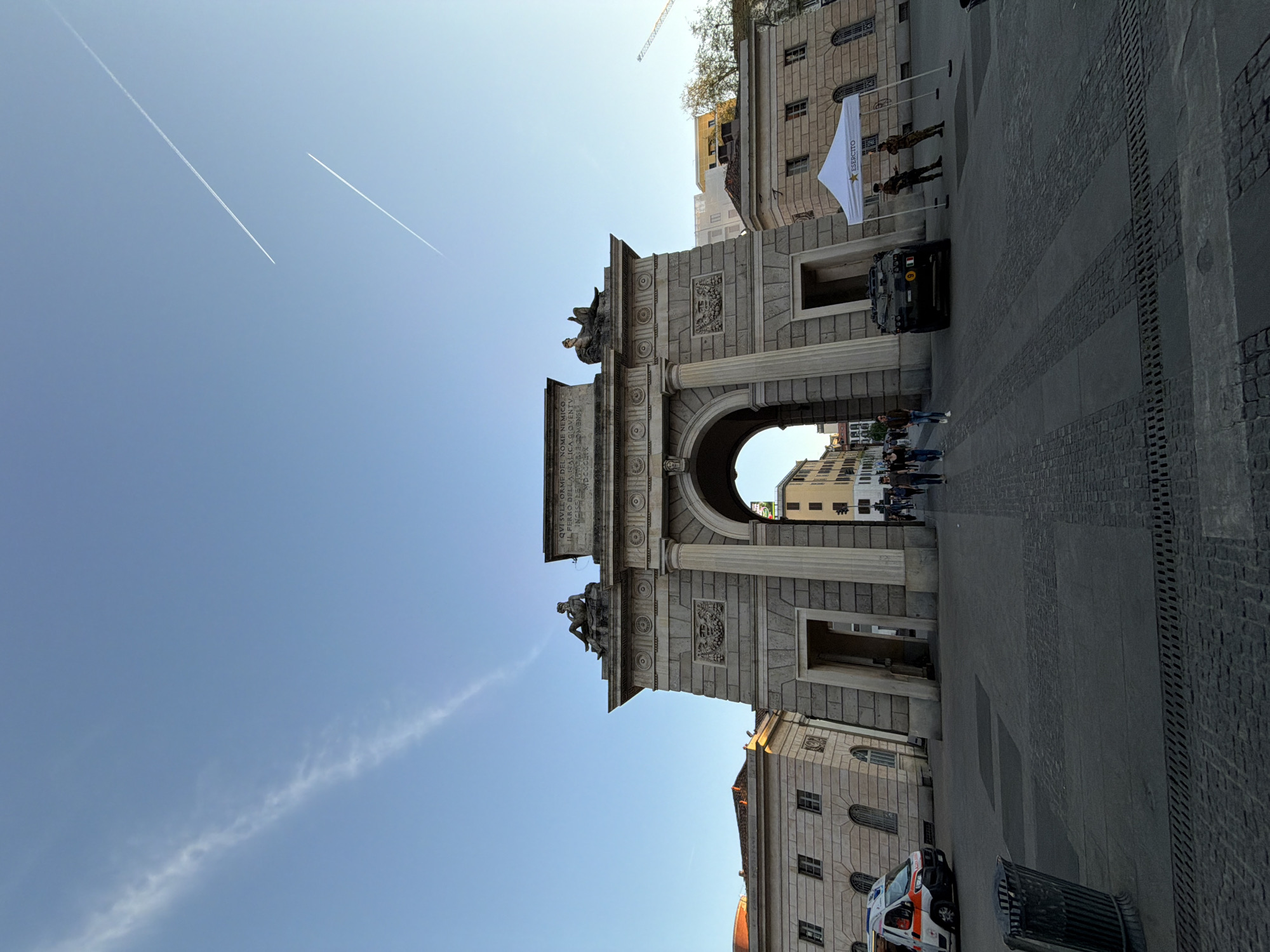 Tourist documents Milan architectural landmarks during afternoon walking tour