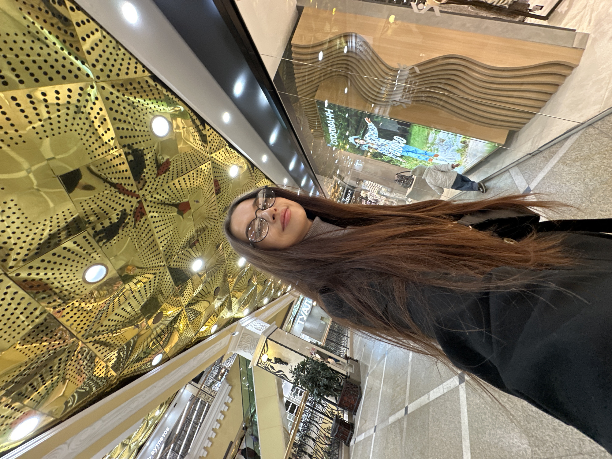 Mother and child explore Yekaterinburg shopping mall during morning visit