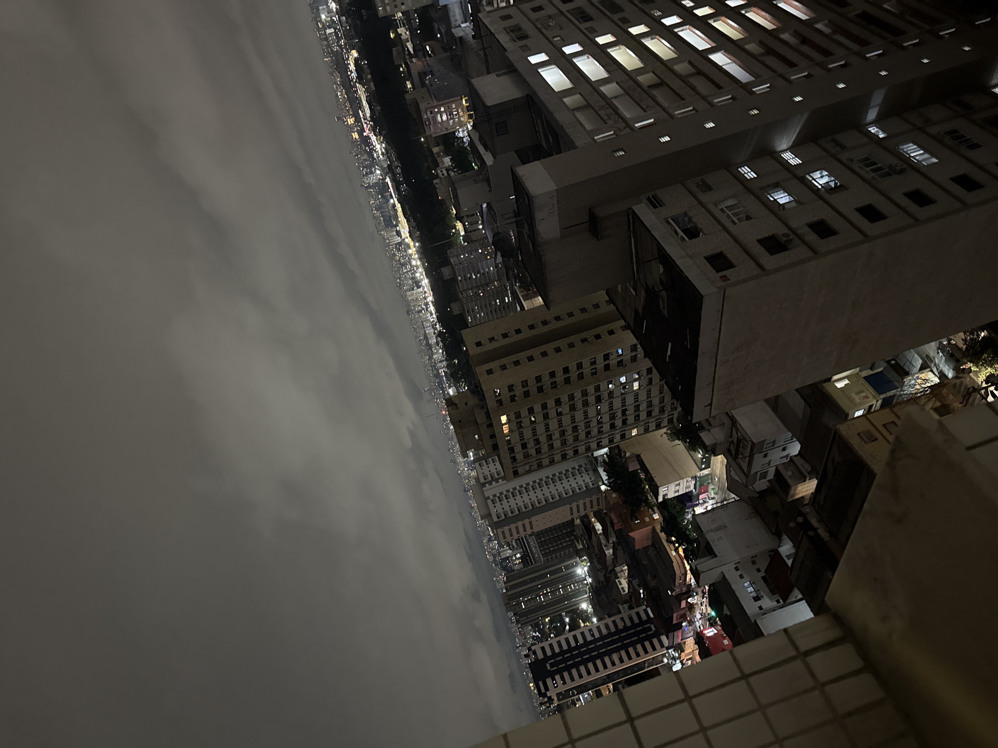 Nighttime aerial views document São Paulo cityscape under cloudy skies