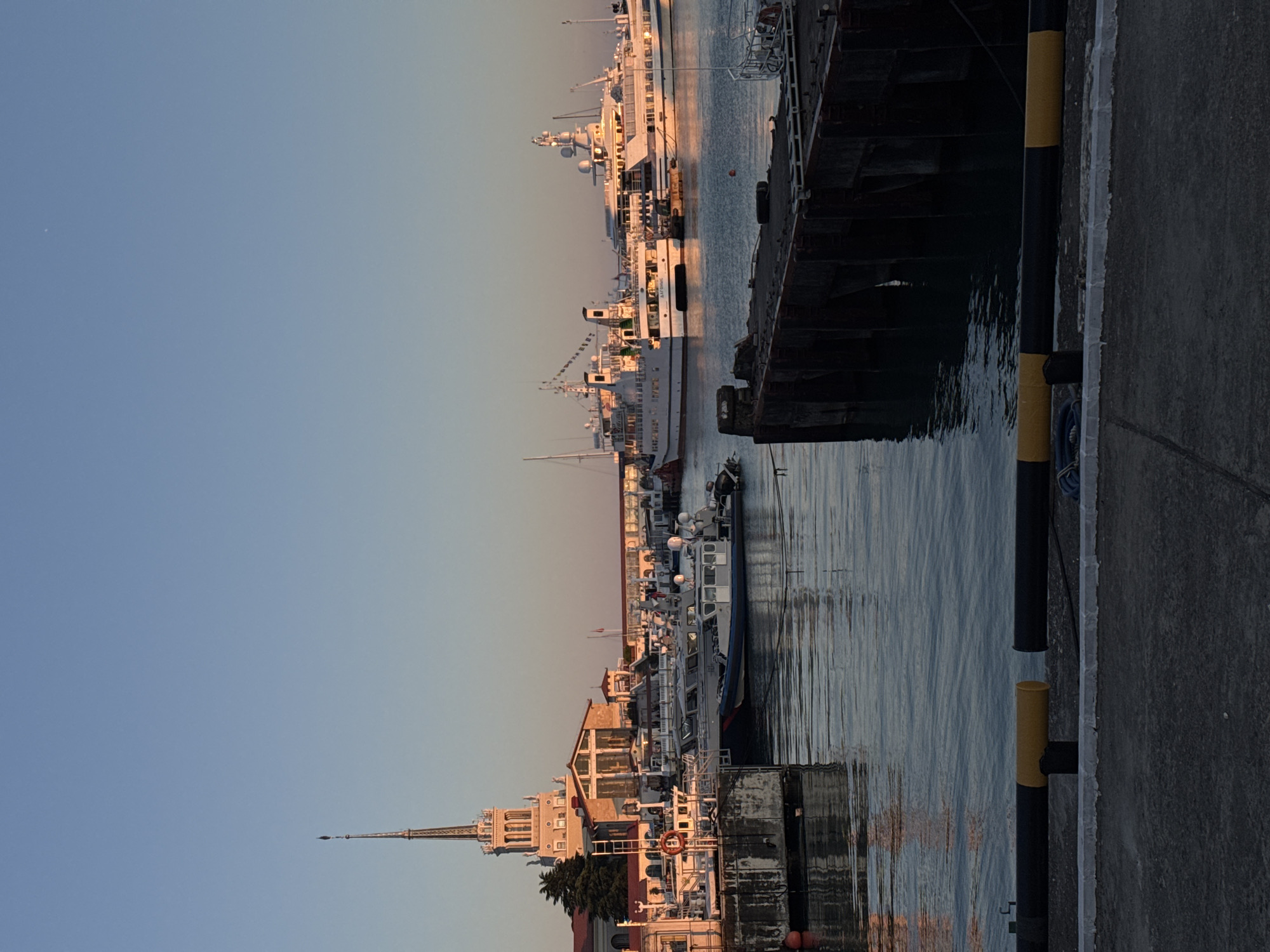 Harbor city scenes: boats, buildings, and luxury cars observed