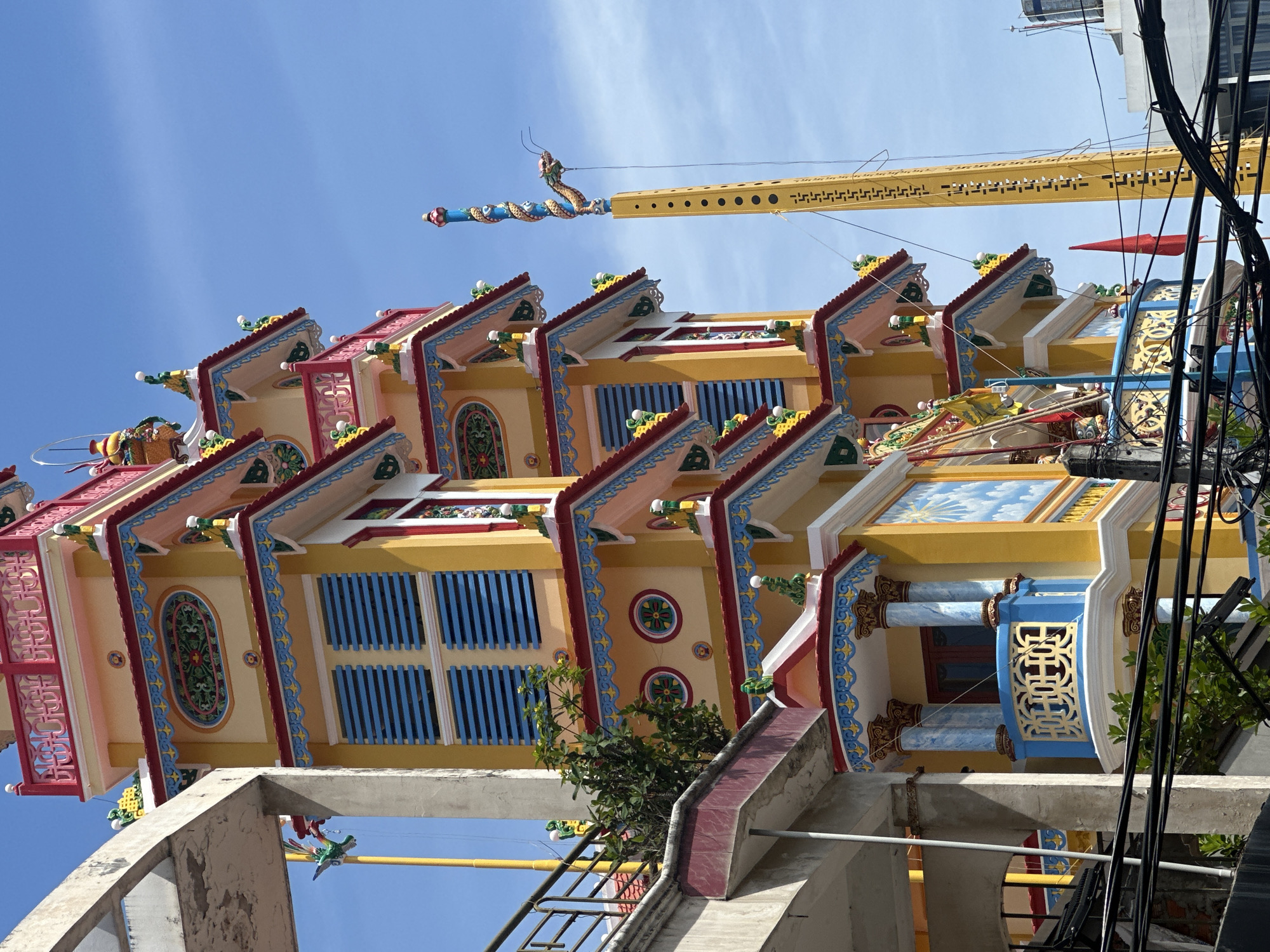 Tourist captures colorful pagoda and beach vendors in Nha Trang