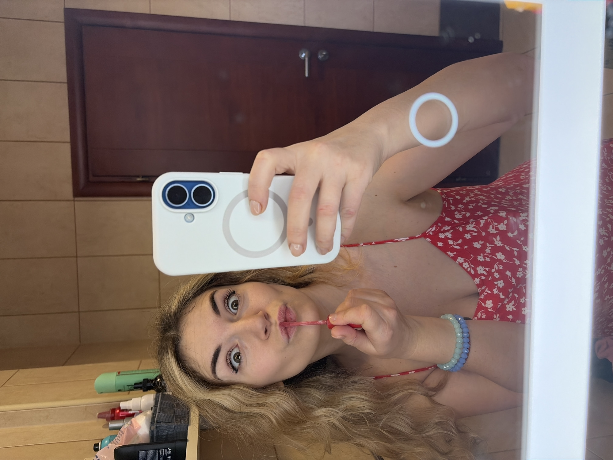 Woman documents morning routine in Budva bathroom