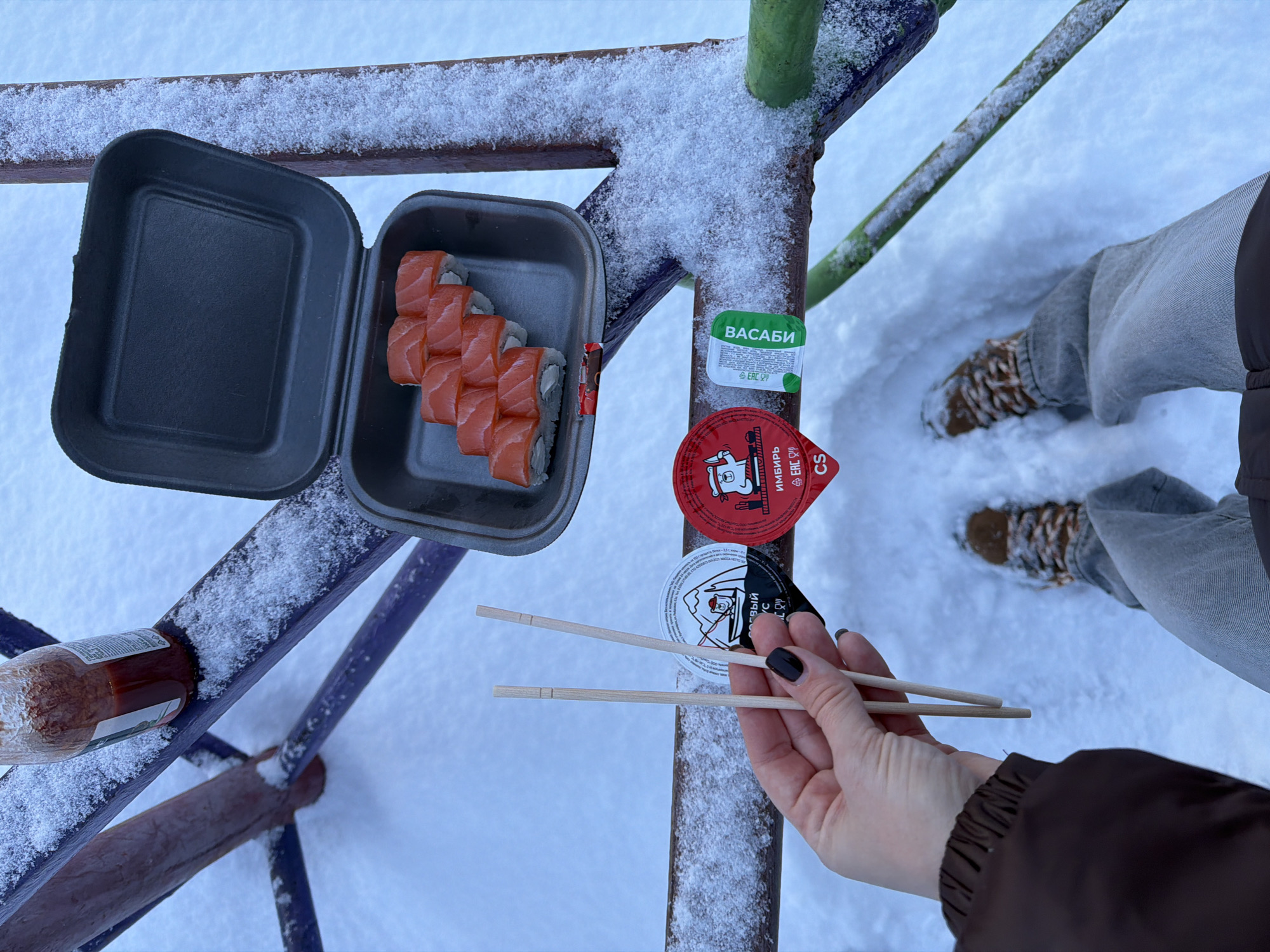 Snowy picnic spotted on playground equipment in Ust-Ilimsk, Russia