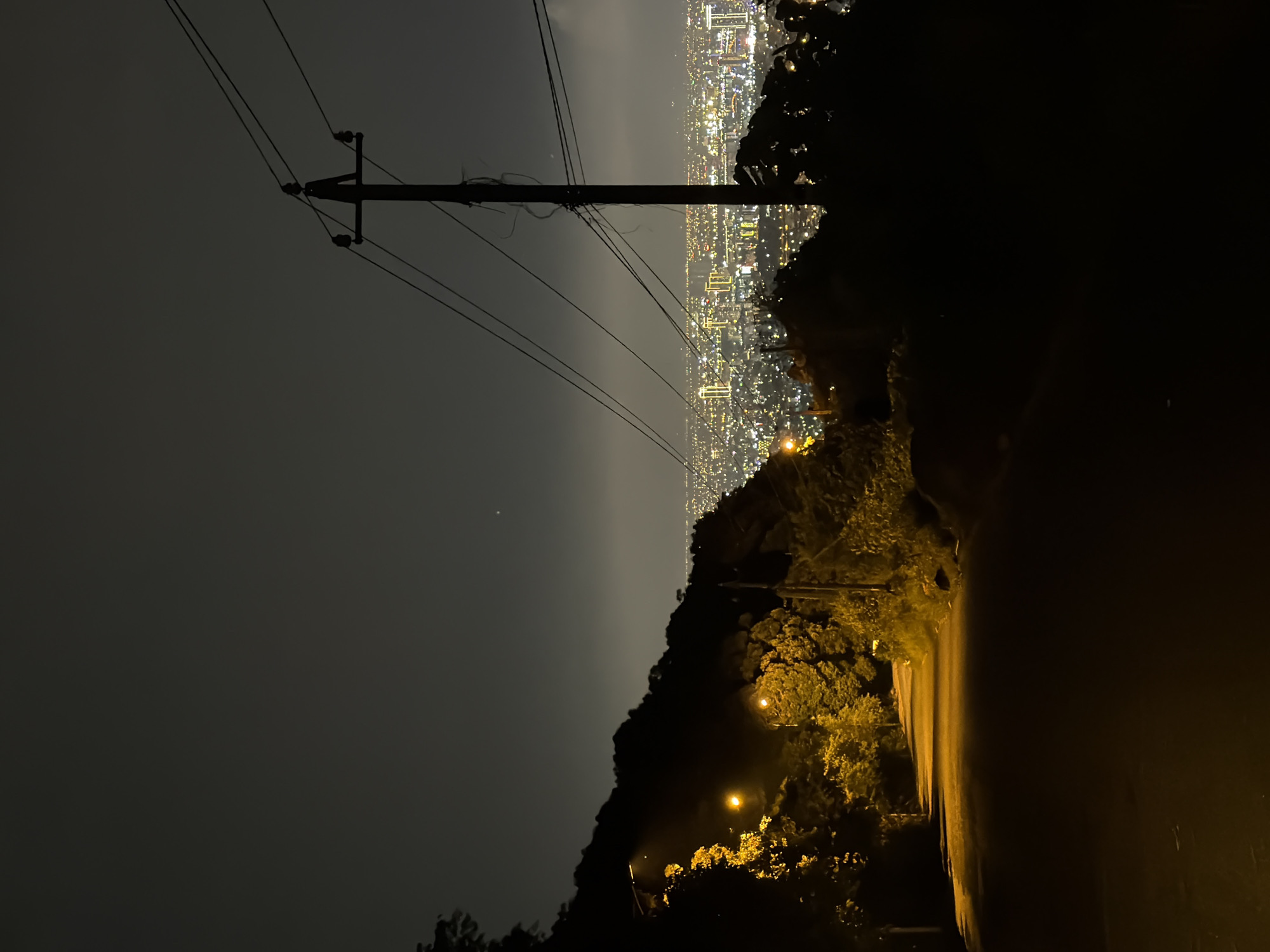 Elevated nighttime view captures illuminated Đà Nẵng cityscape