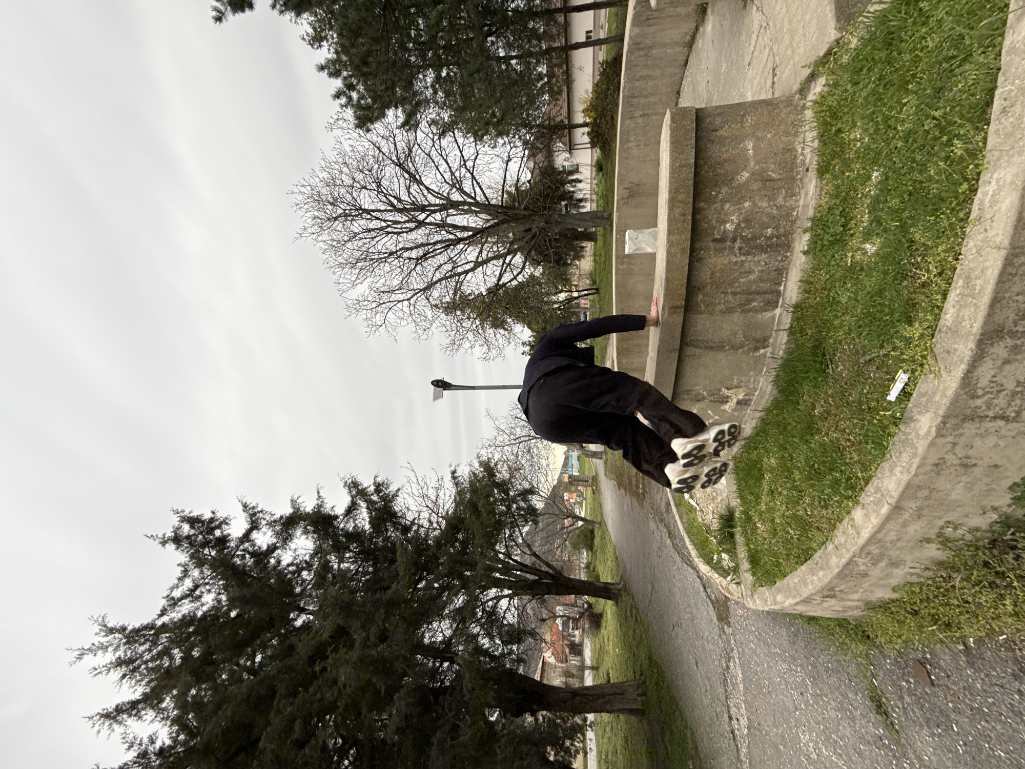 Man performs parkour tricks at concrete structure in Shumen park