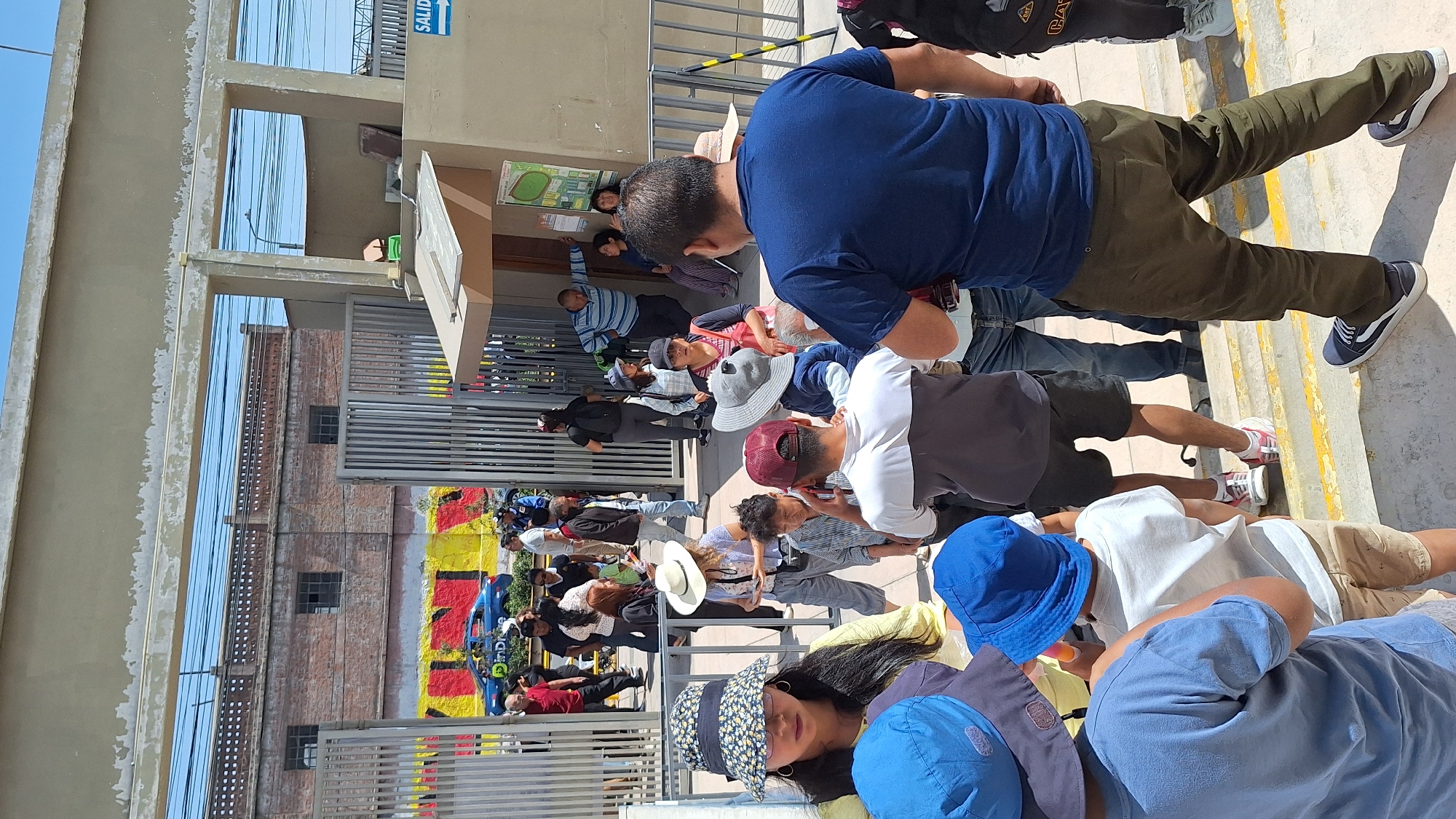 Arequipa residents gather around public notices in Mariano Melgar district