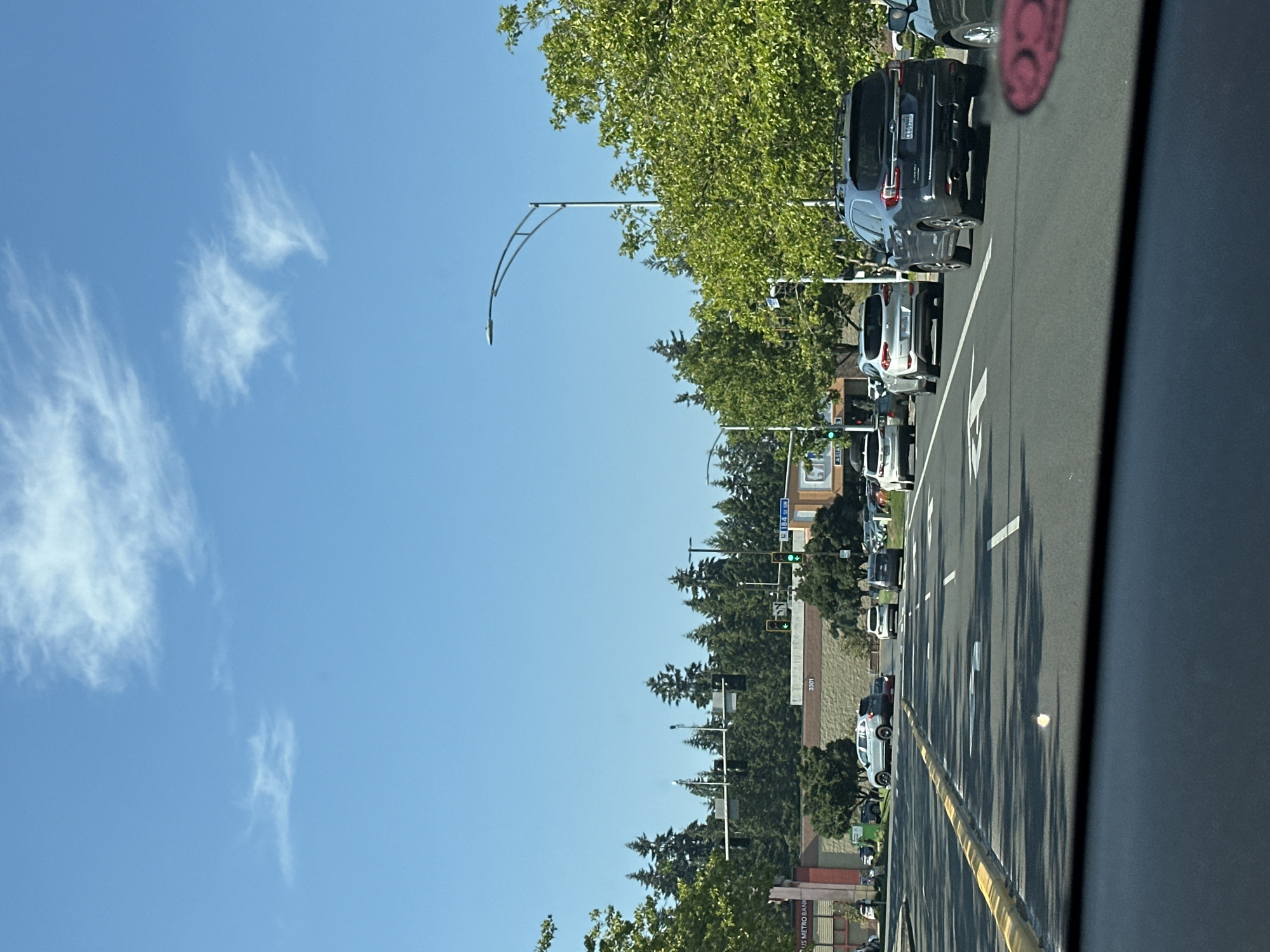 Coffee in hand, moving through a sunny Lynnwood afternoon
