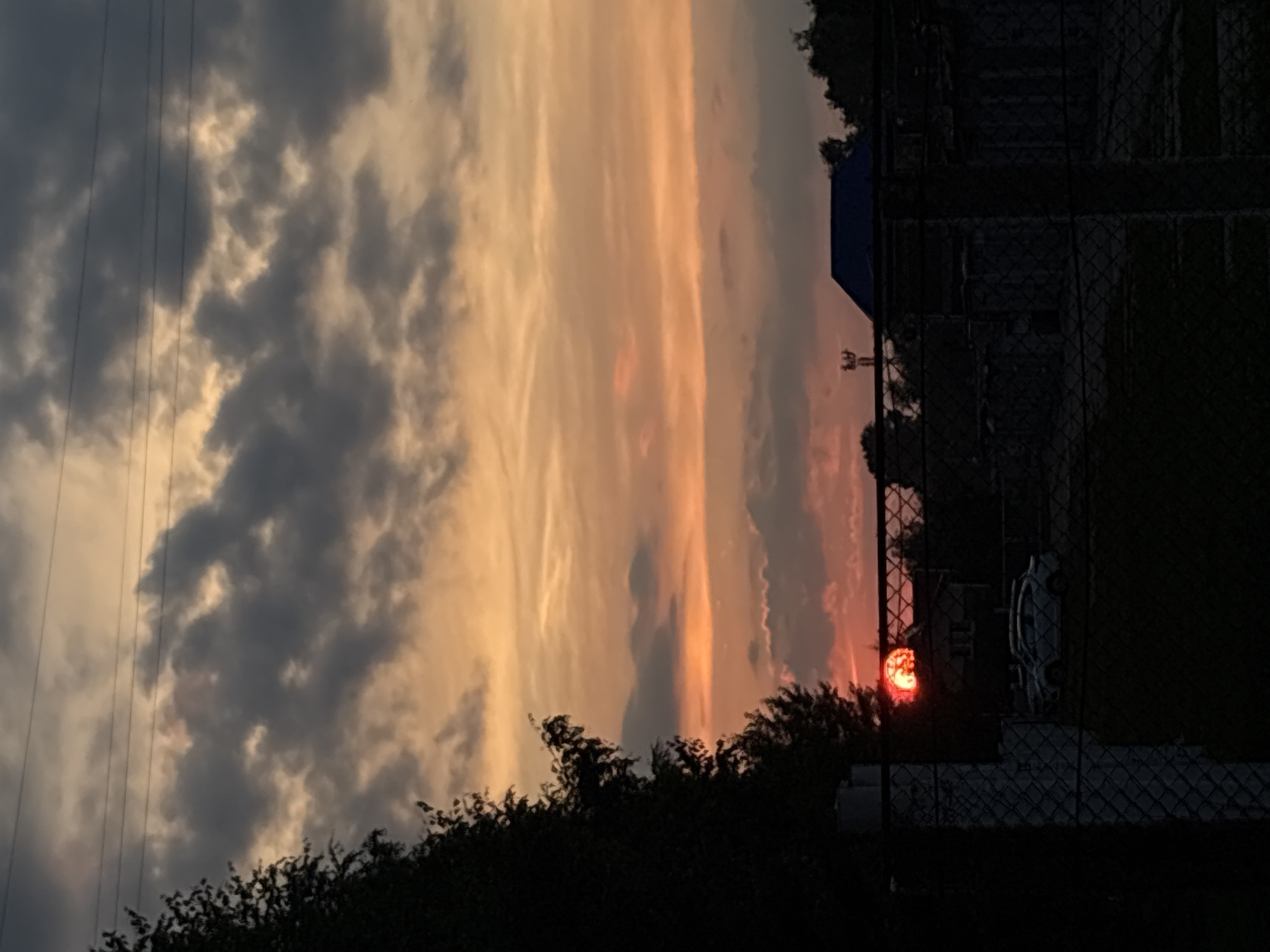 Railway junction and city streets at sunset, dramatic skies