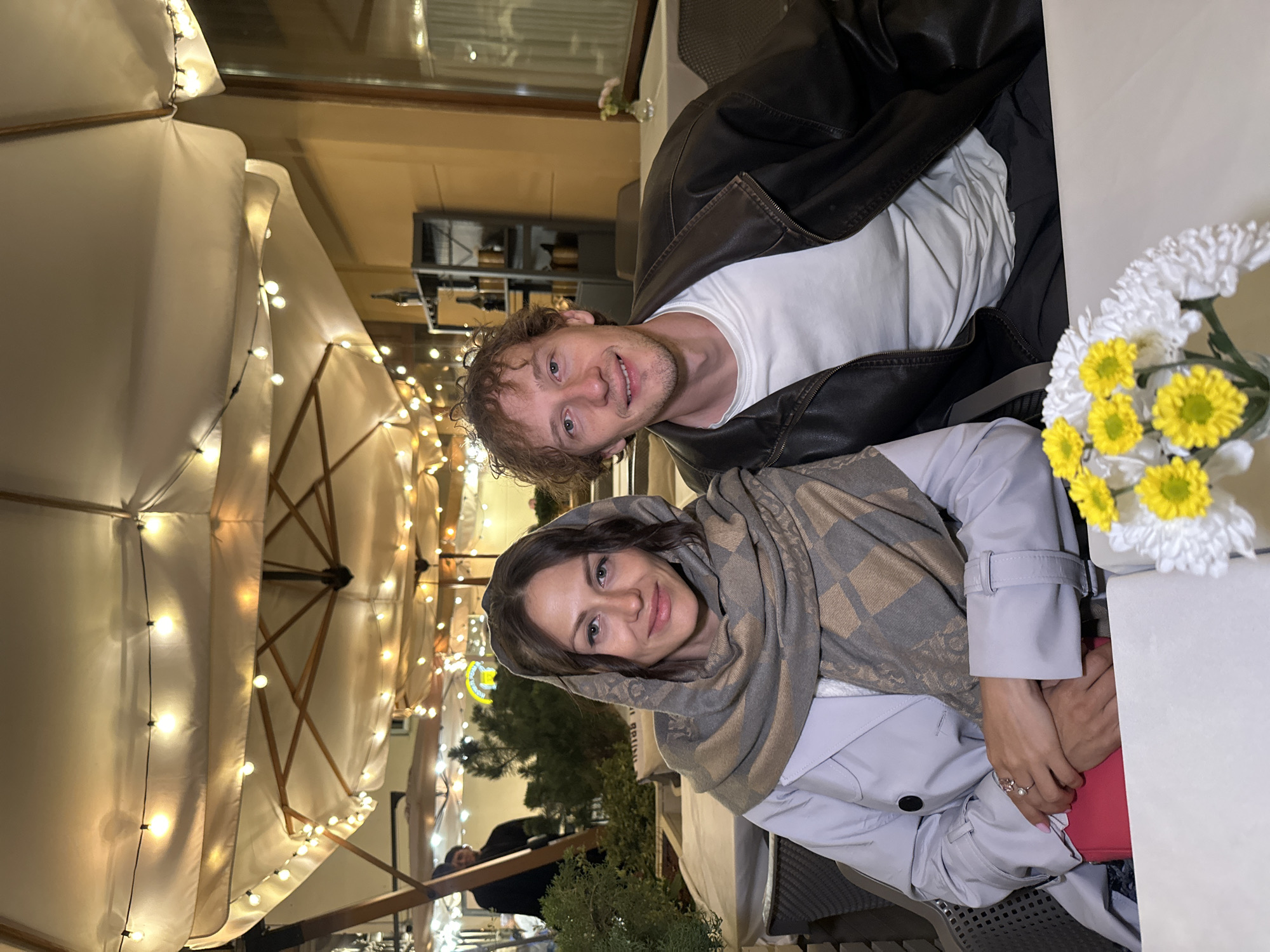 Evening at a lit outdoor café in Saint Petersburg
