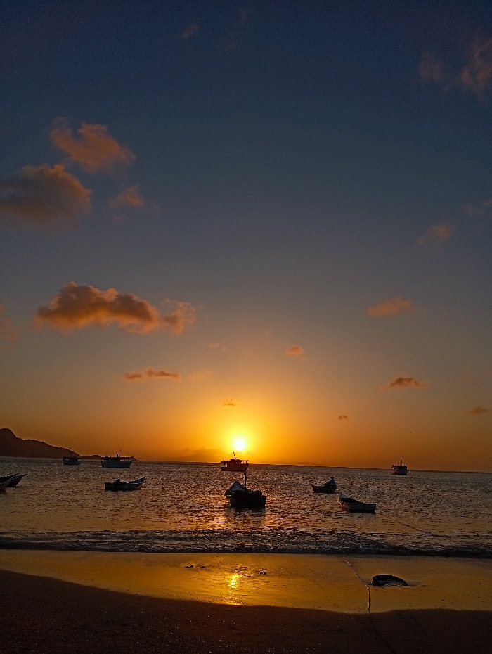 Golden sunset draws crowds to Juan Griego beach Venezuela
