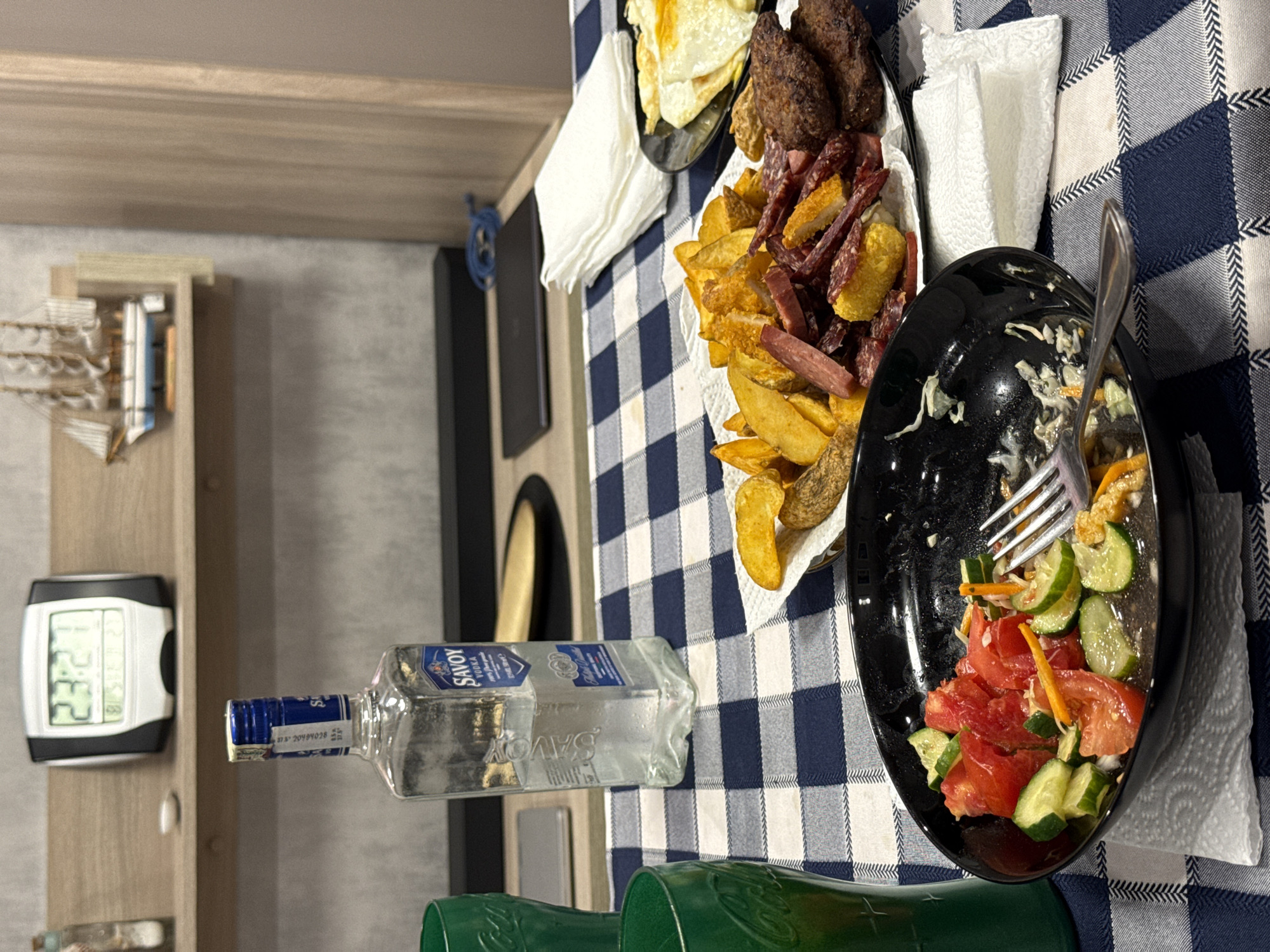 Half-eaten salad on a checkered tablecloth in Lovech