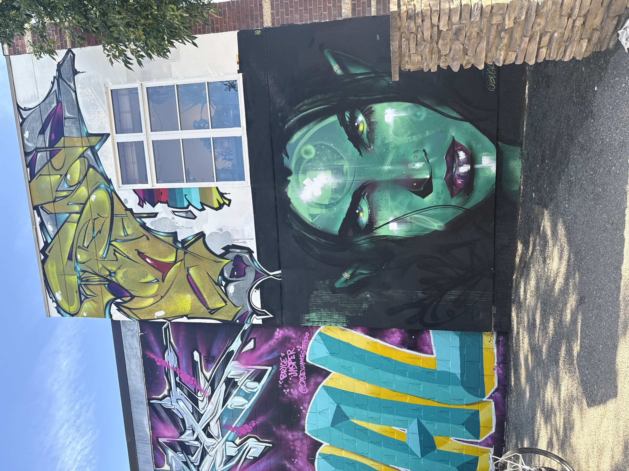 Calgary street art corridor with murals, graffiti, and local spots