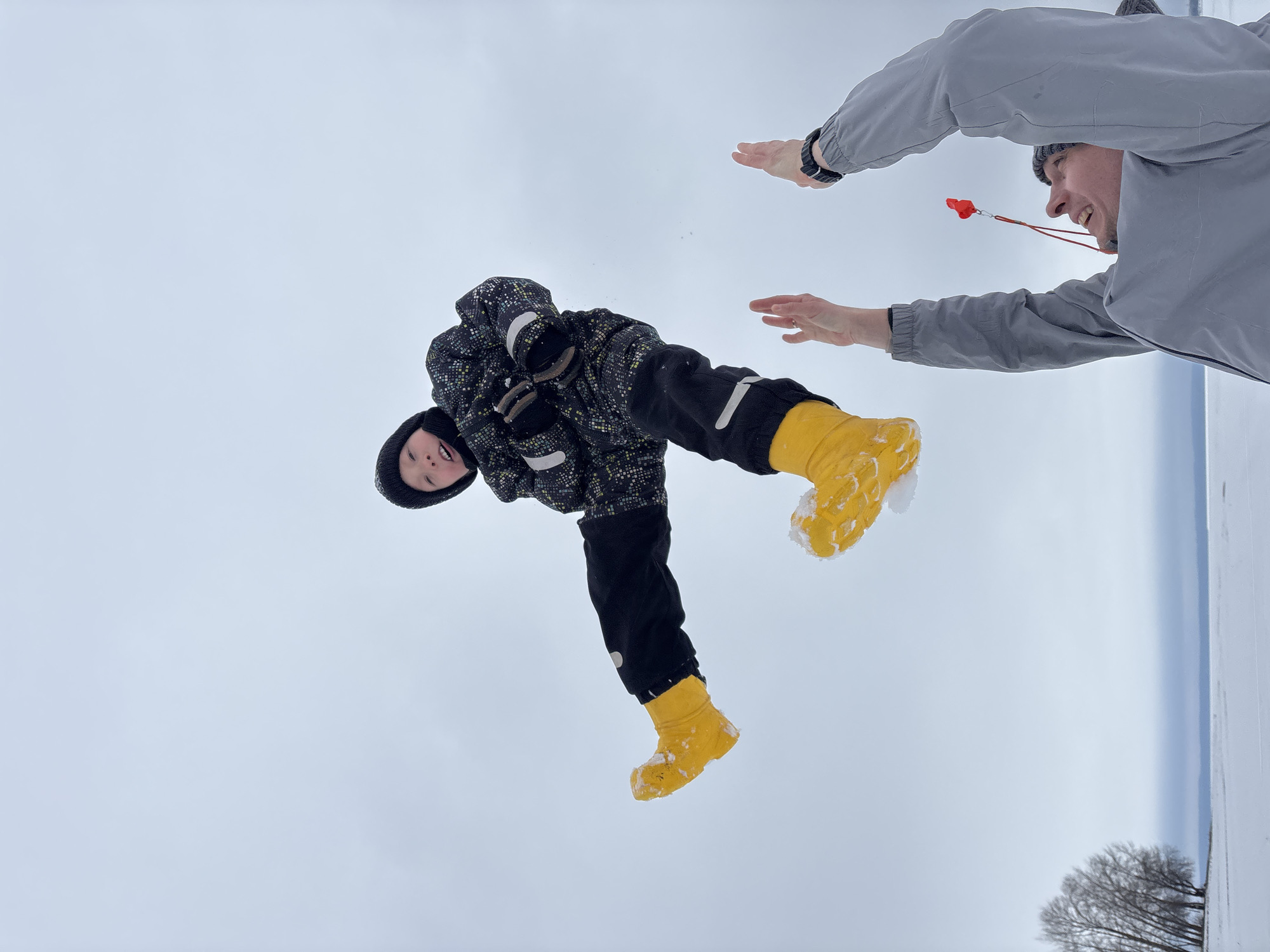 Child held upside down in snow in Chaikovsky, Russia