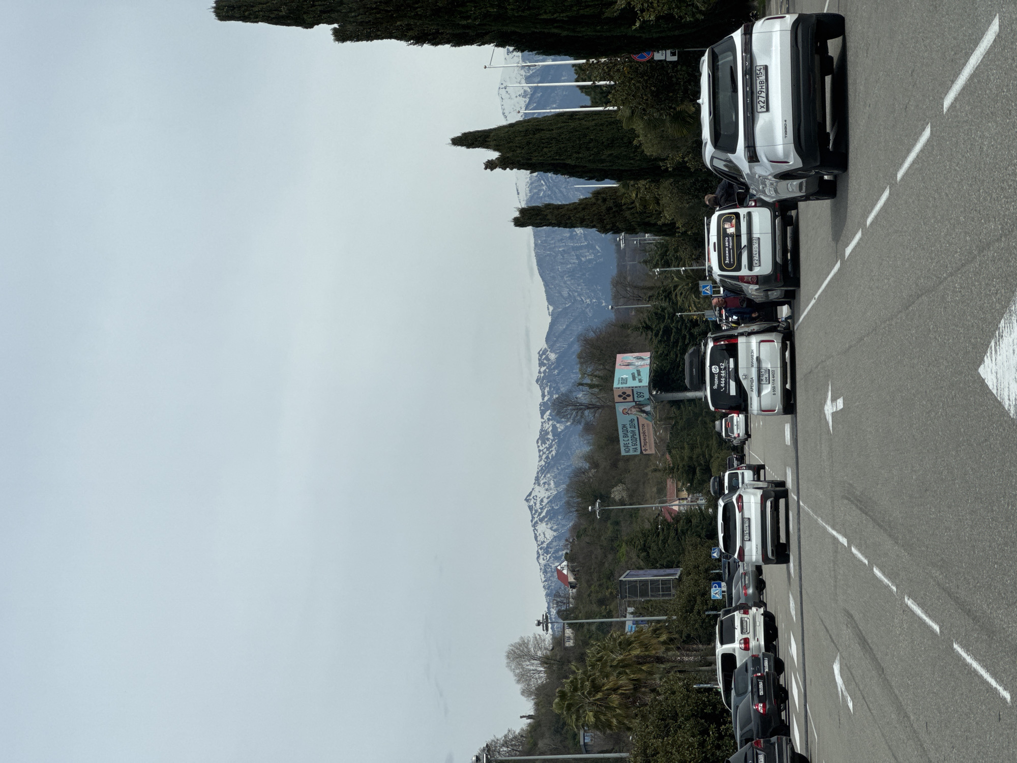 Cars parked along mountain road in Sochi, Russia
